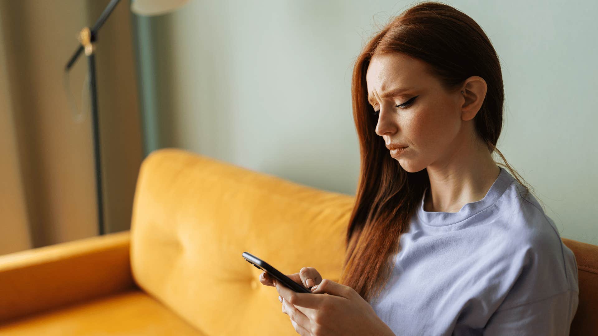 disappointed woman reaching out to friend without receiving a response