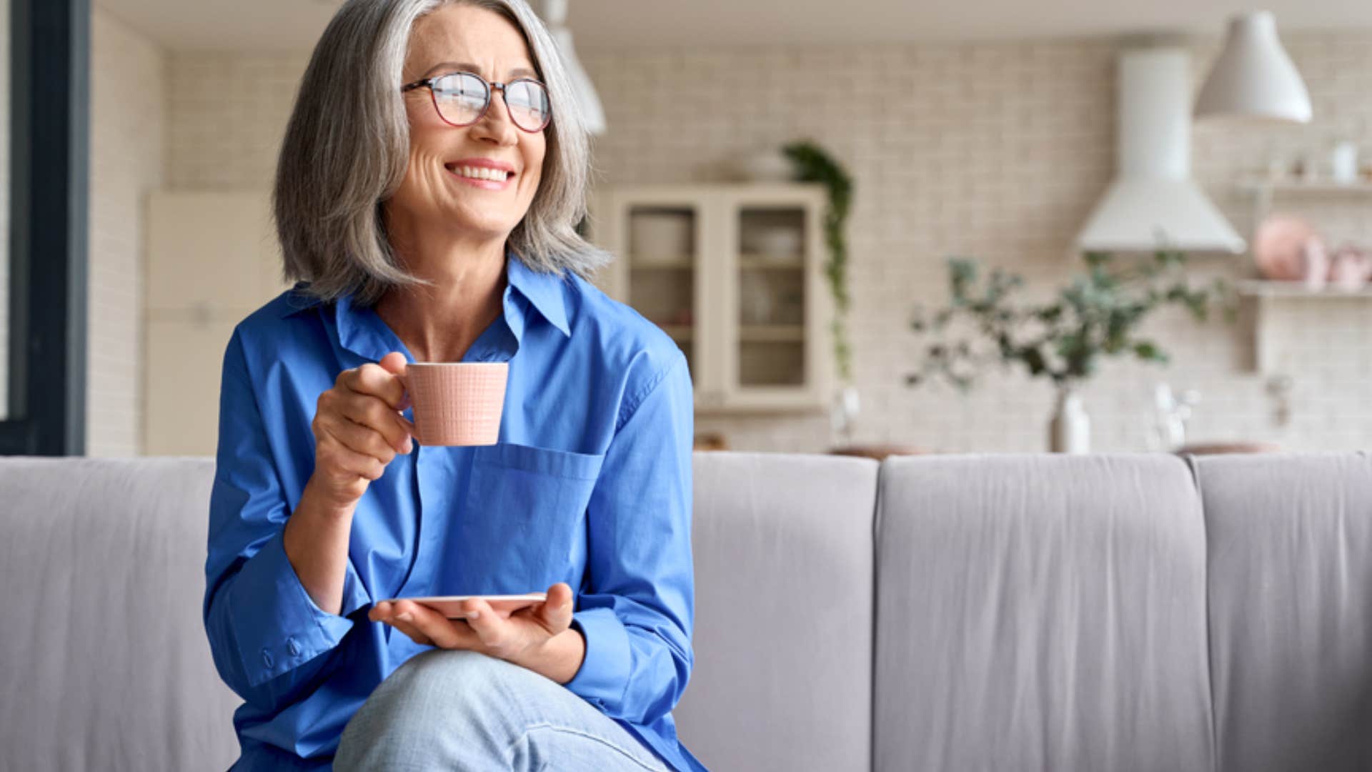 woman drinking coffee happily