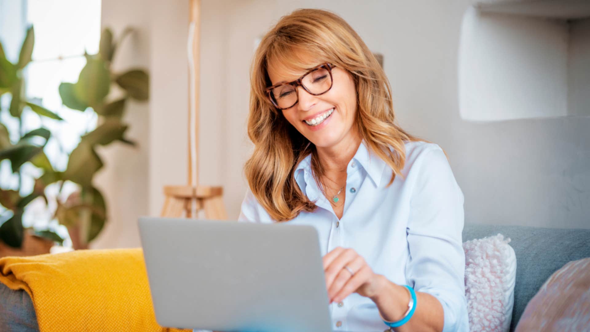 smiling woman using her computer