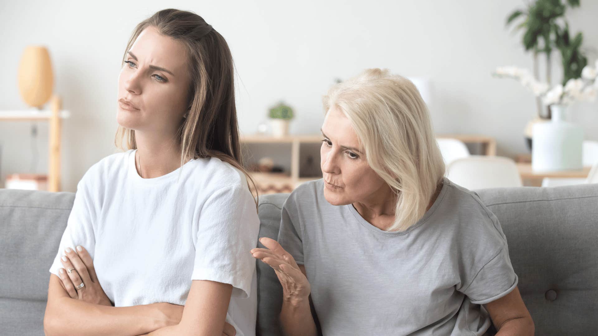 older woman telling adult woman about hard work