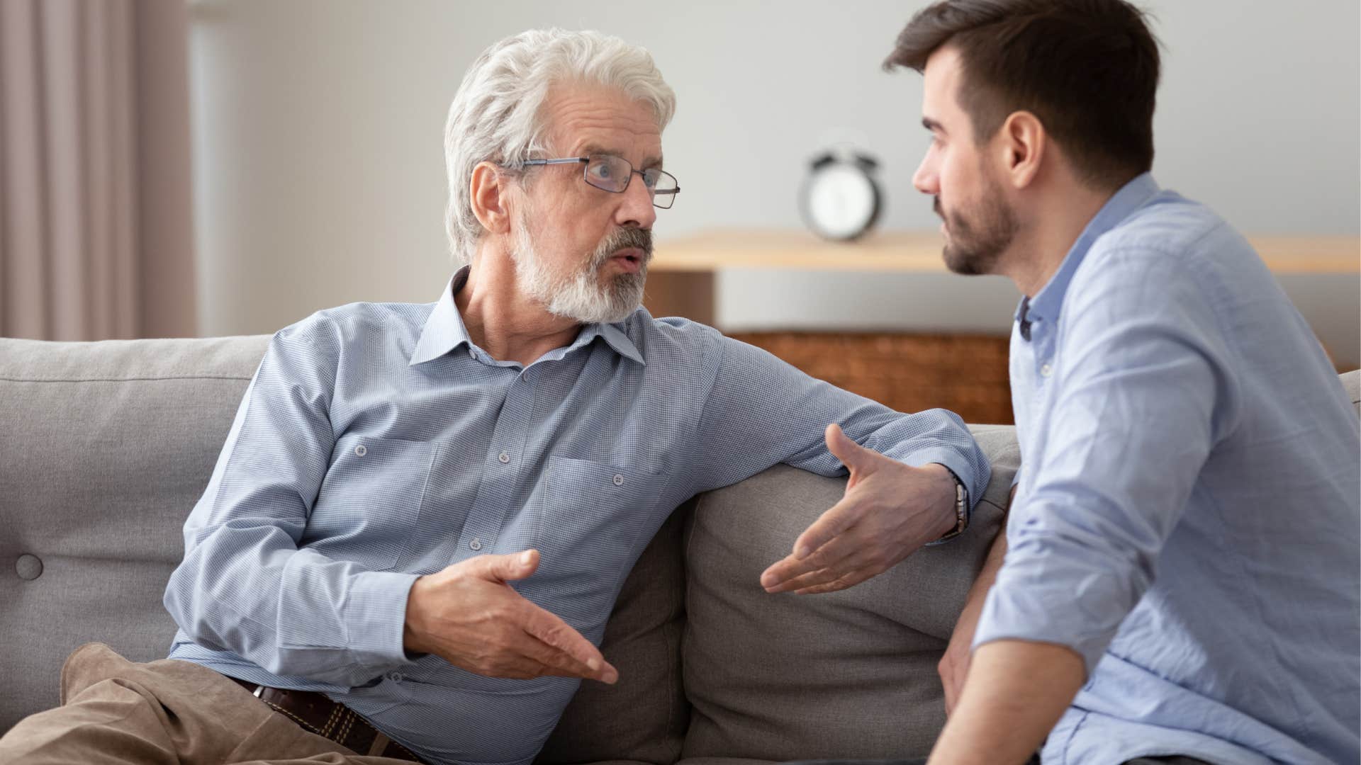 older man arguing with son about the world