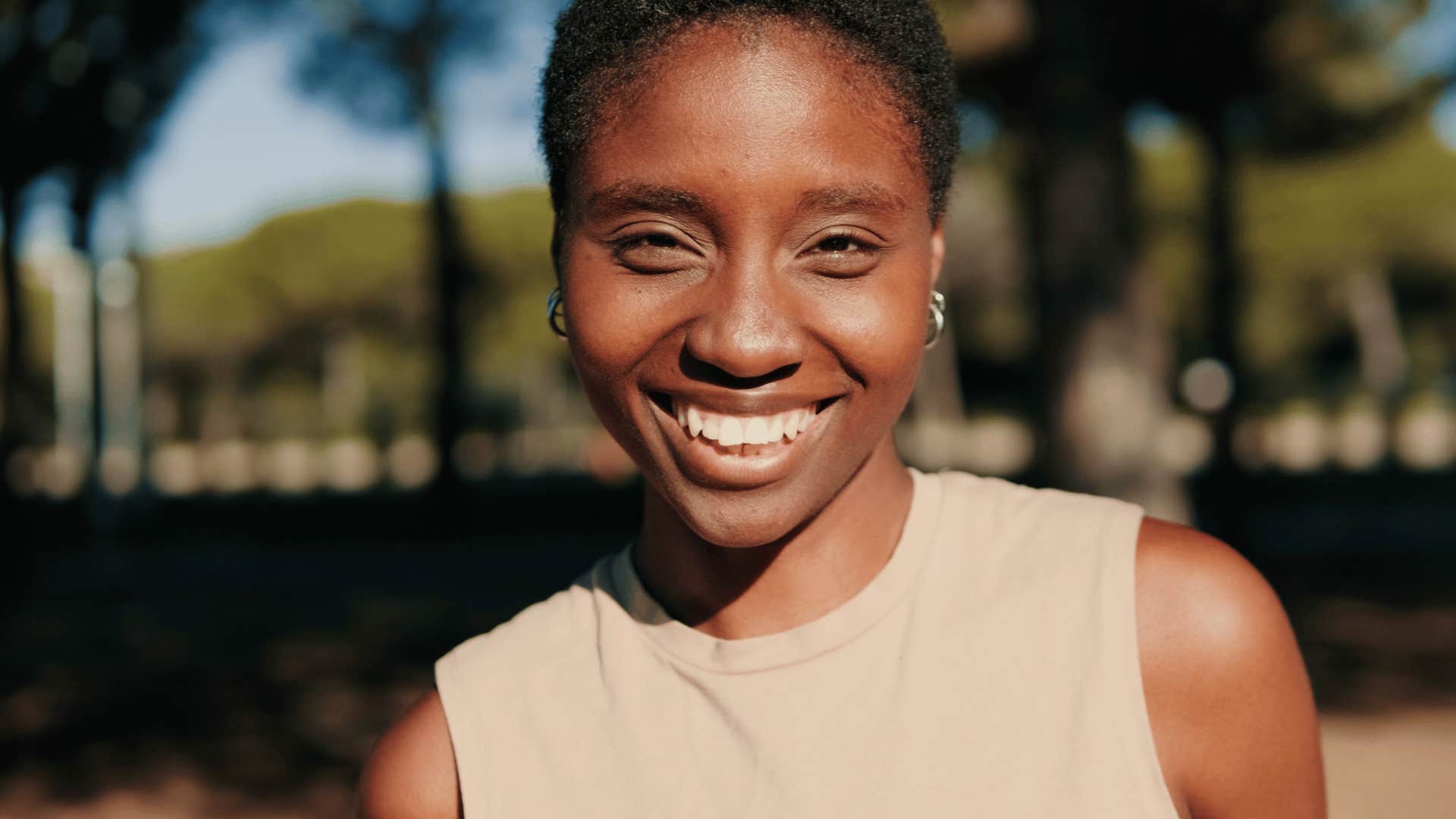 happy smiling woman with radiant energy