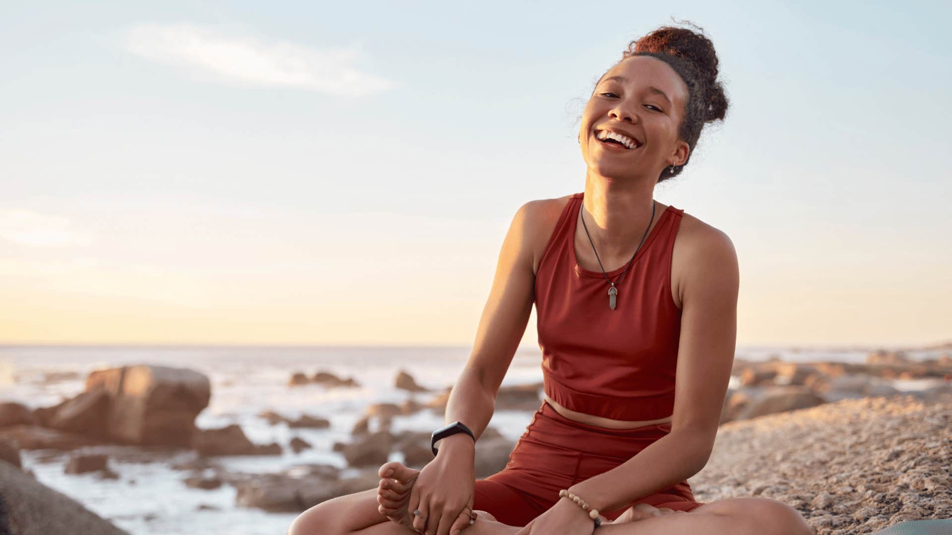 peaceful woman sitting on the beach