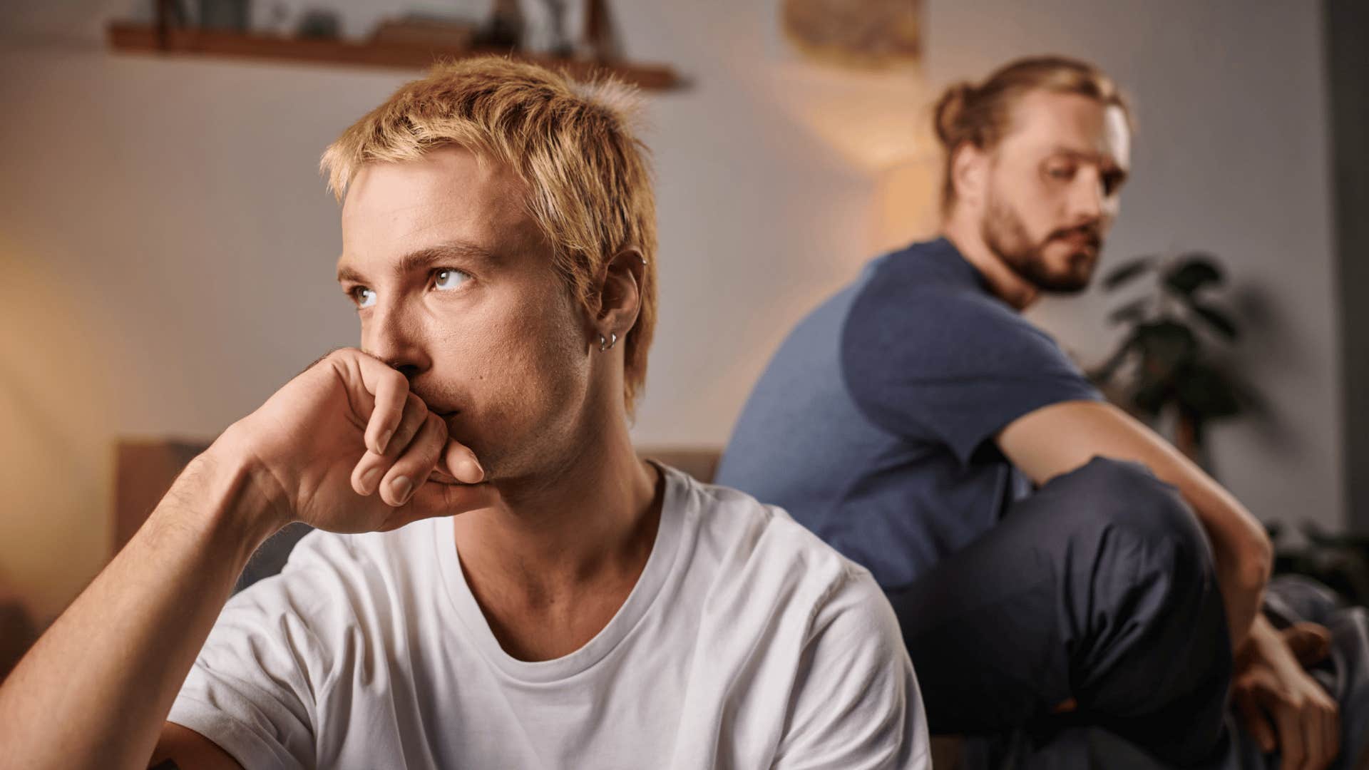 sensitive man turned away from friend