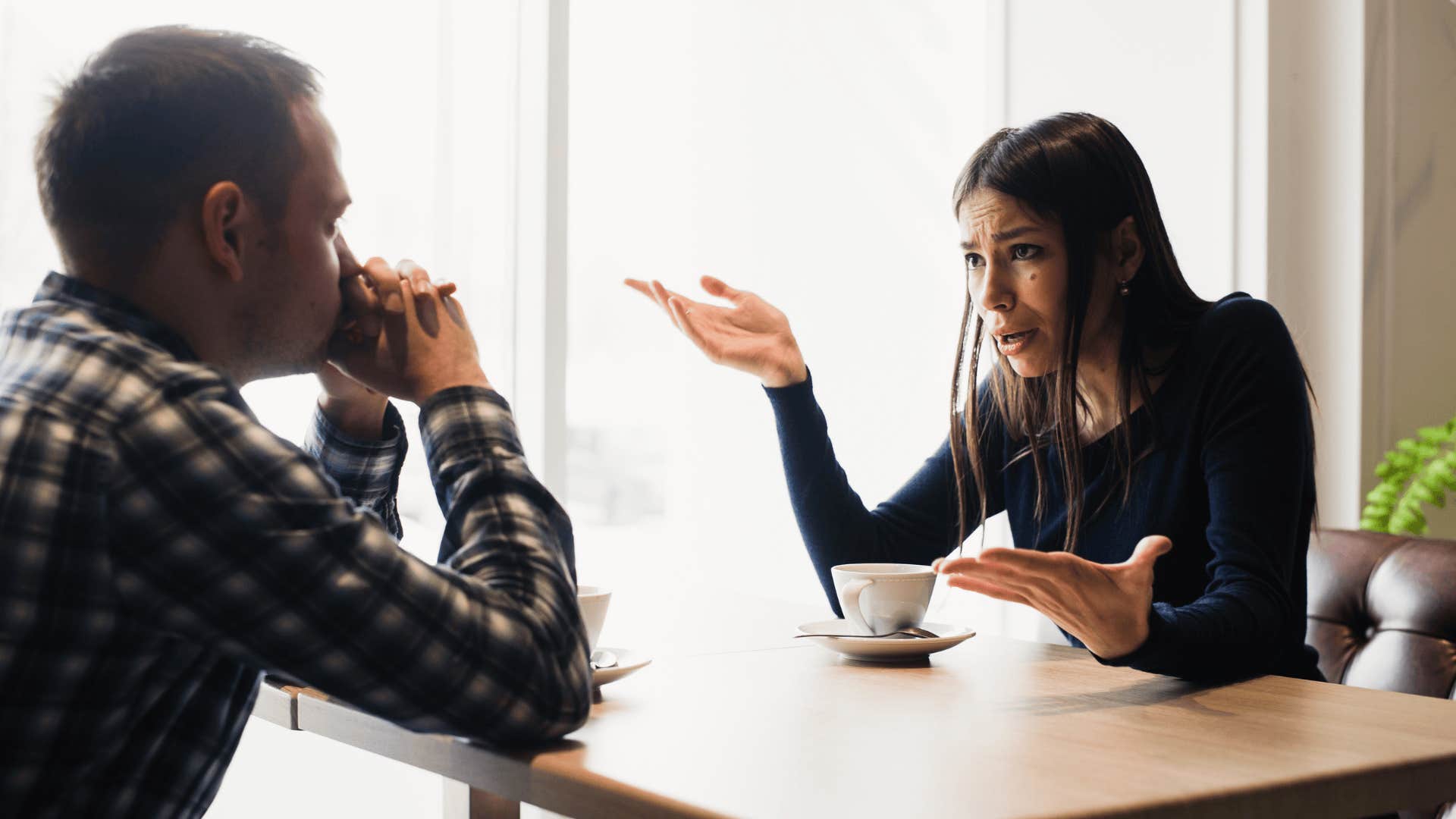 woman arguing with man after he said something about her rough childhood