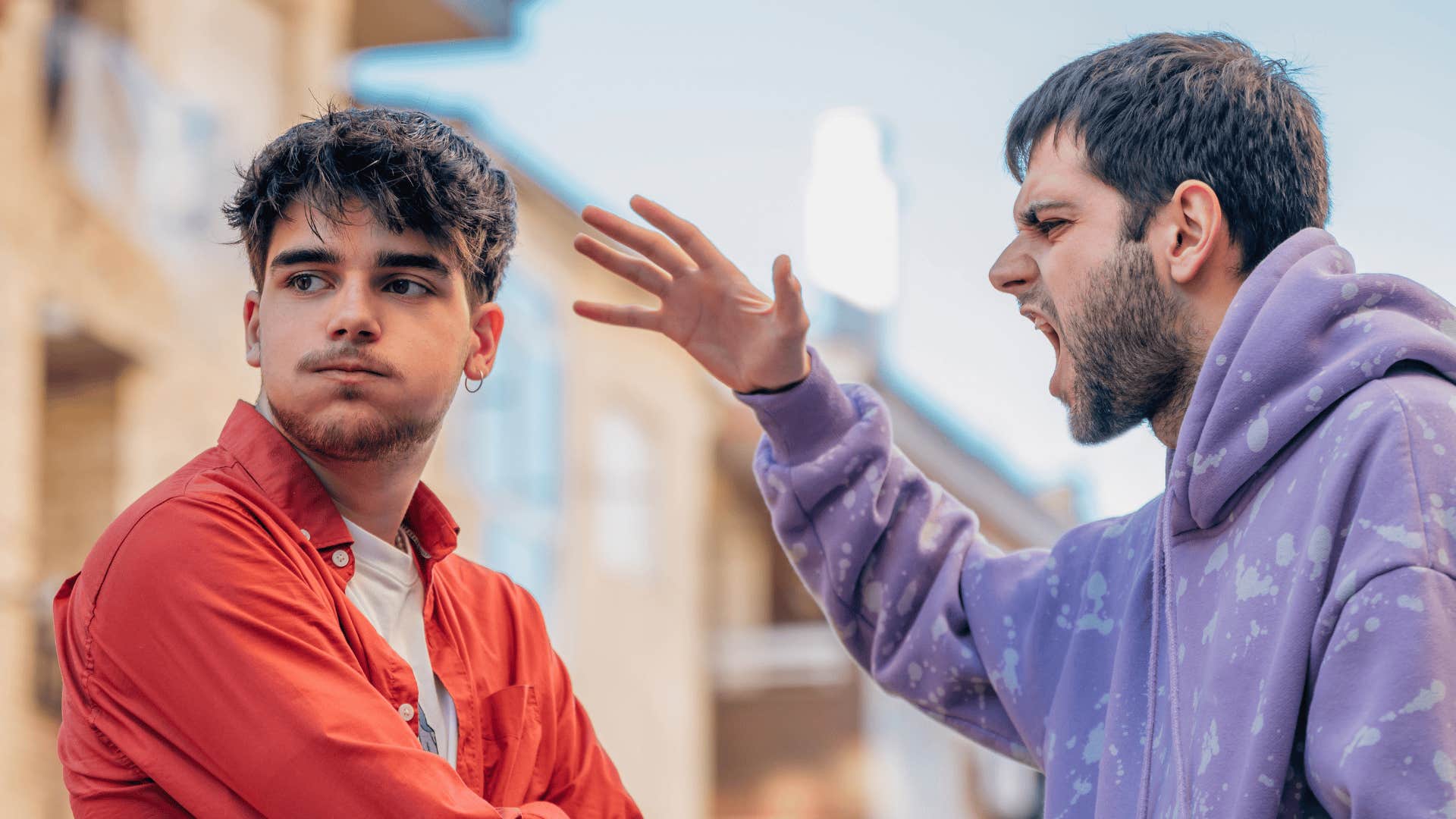 upset man arguing with friend who said something about his rough childhood