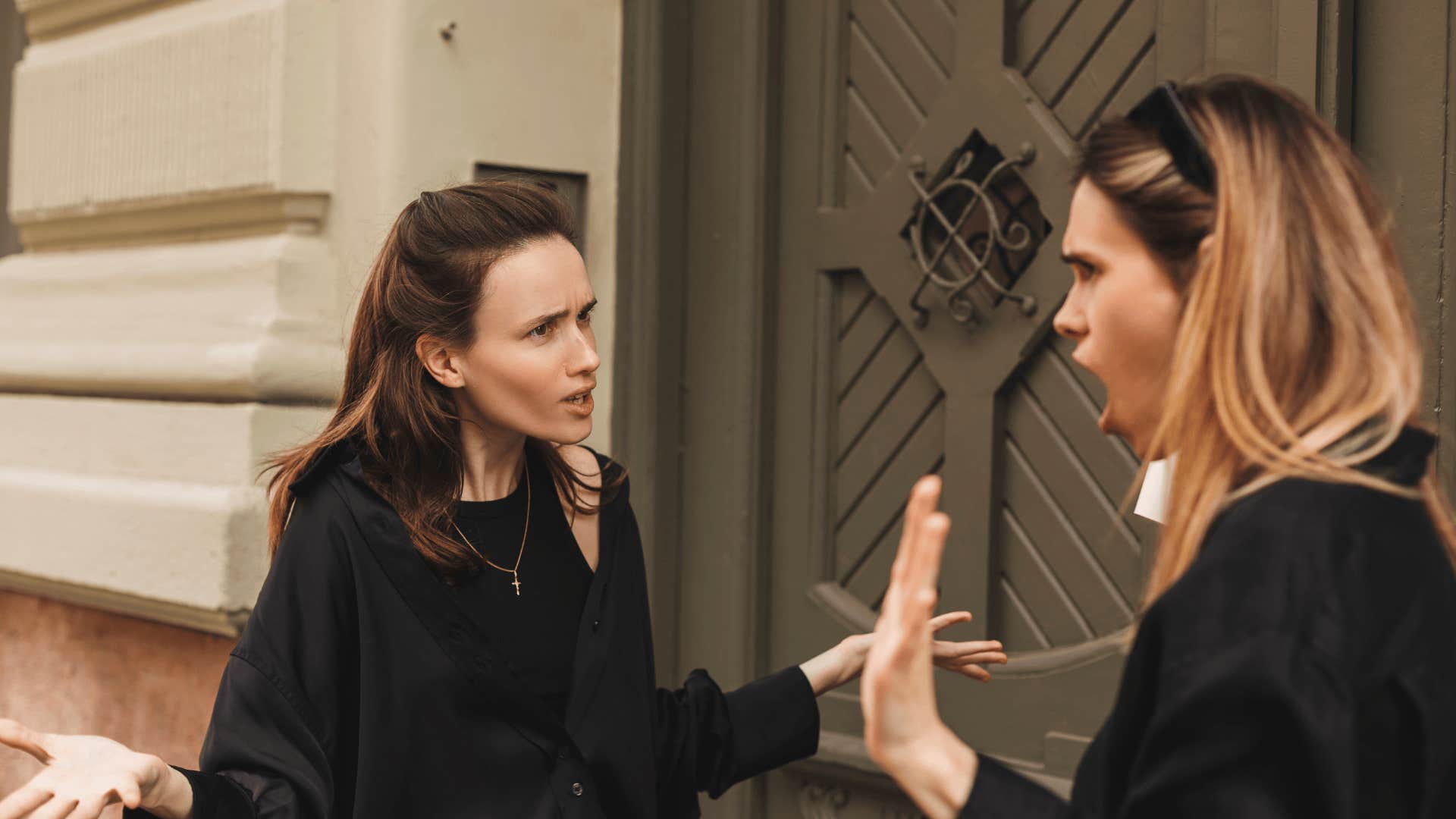 woman arguing with friend after she said something about her rough childhood