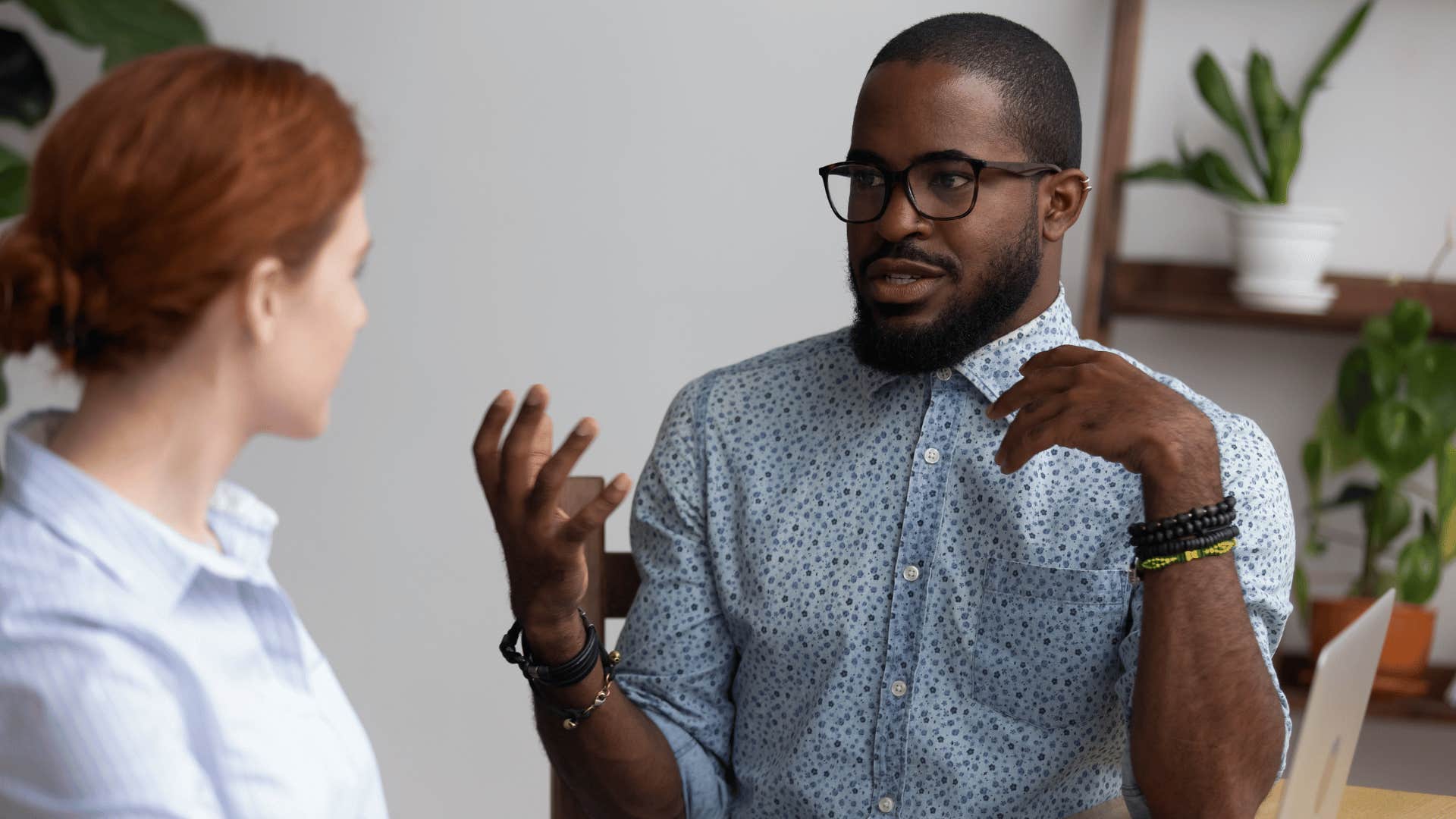 Man and woman resolve conflict together through discussion