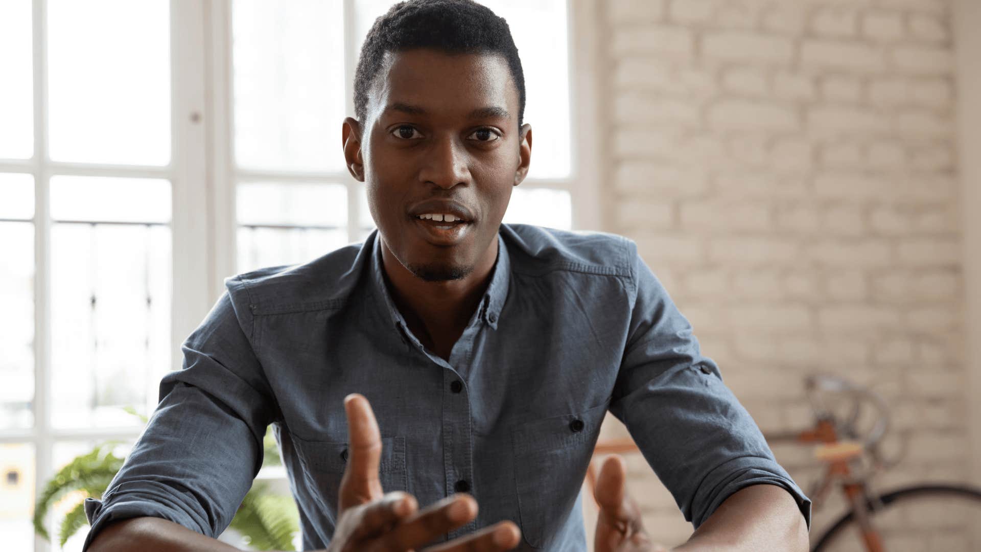 unsure man talking to friend