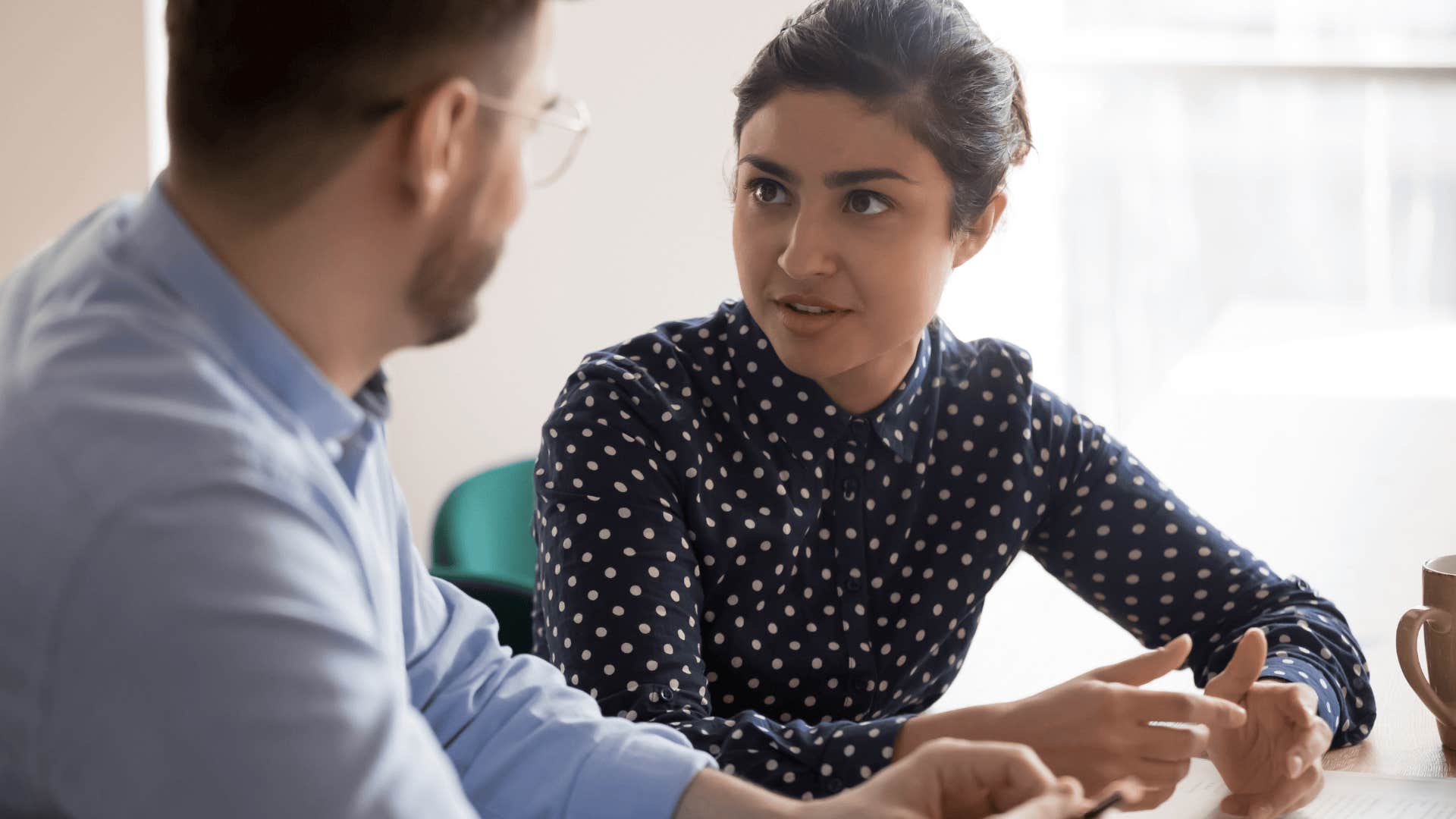 woman having a conversation with a co-worker