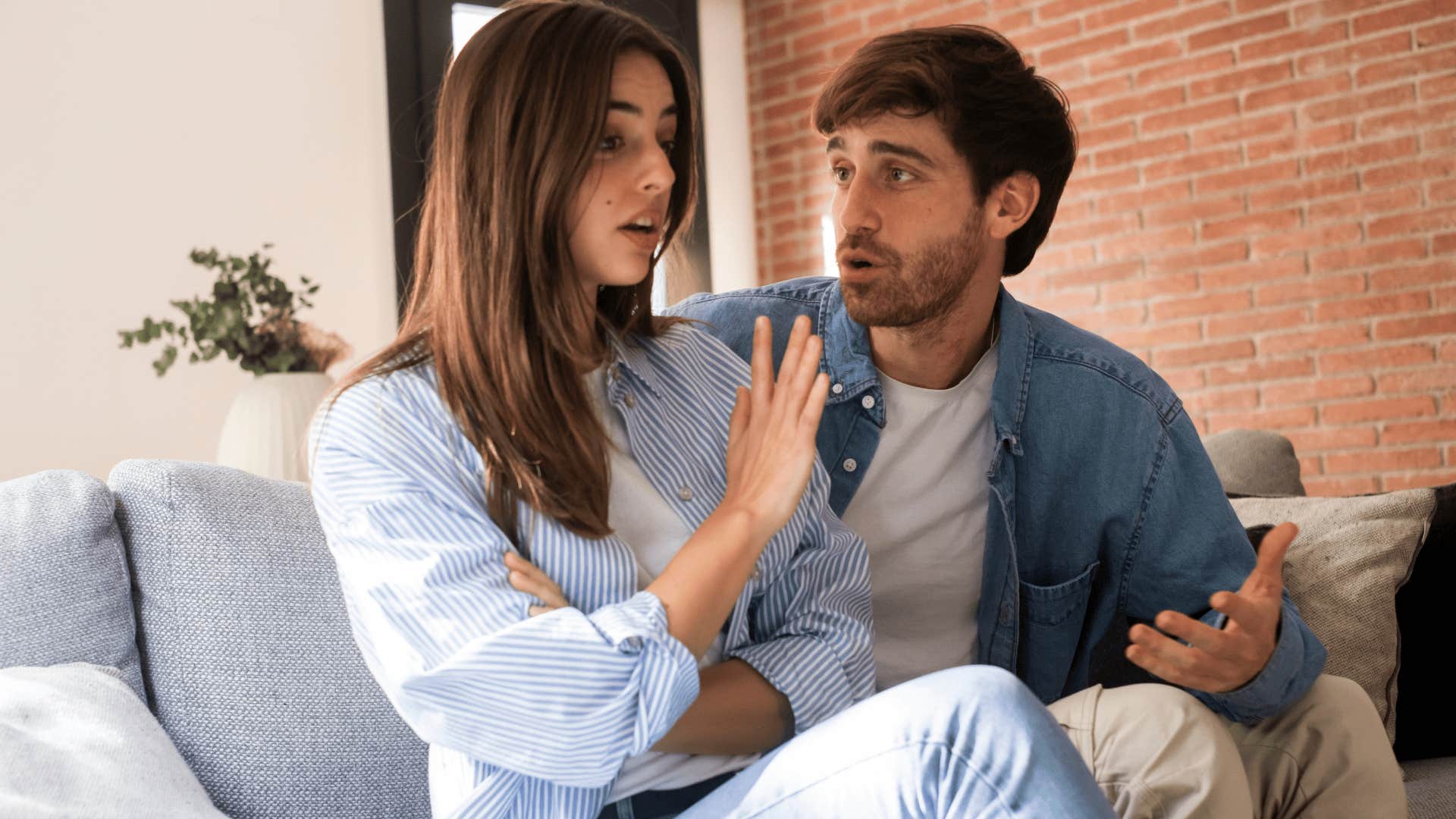 annoyed woman telling man to stop
