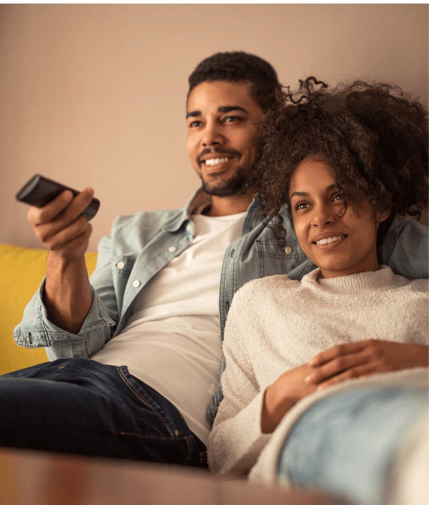 Relaxed couple do the best thing ever and watch movie together