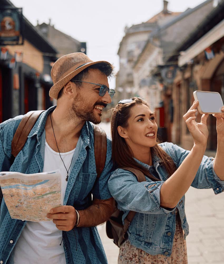 Couple in love question location and look at map while travelling