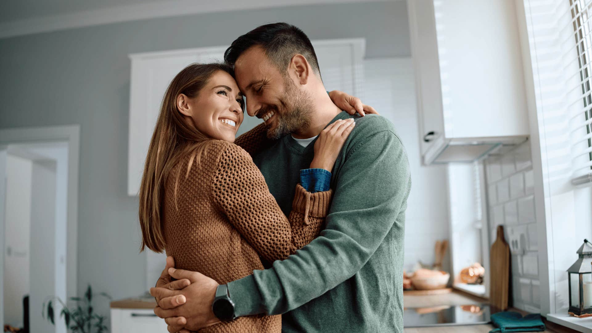 woman hugging partner who is loyal and locked in