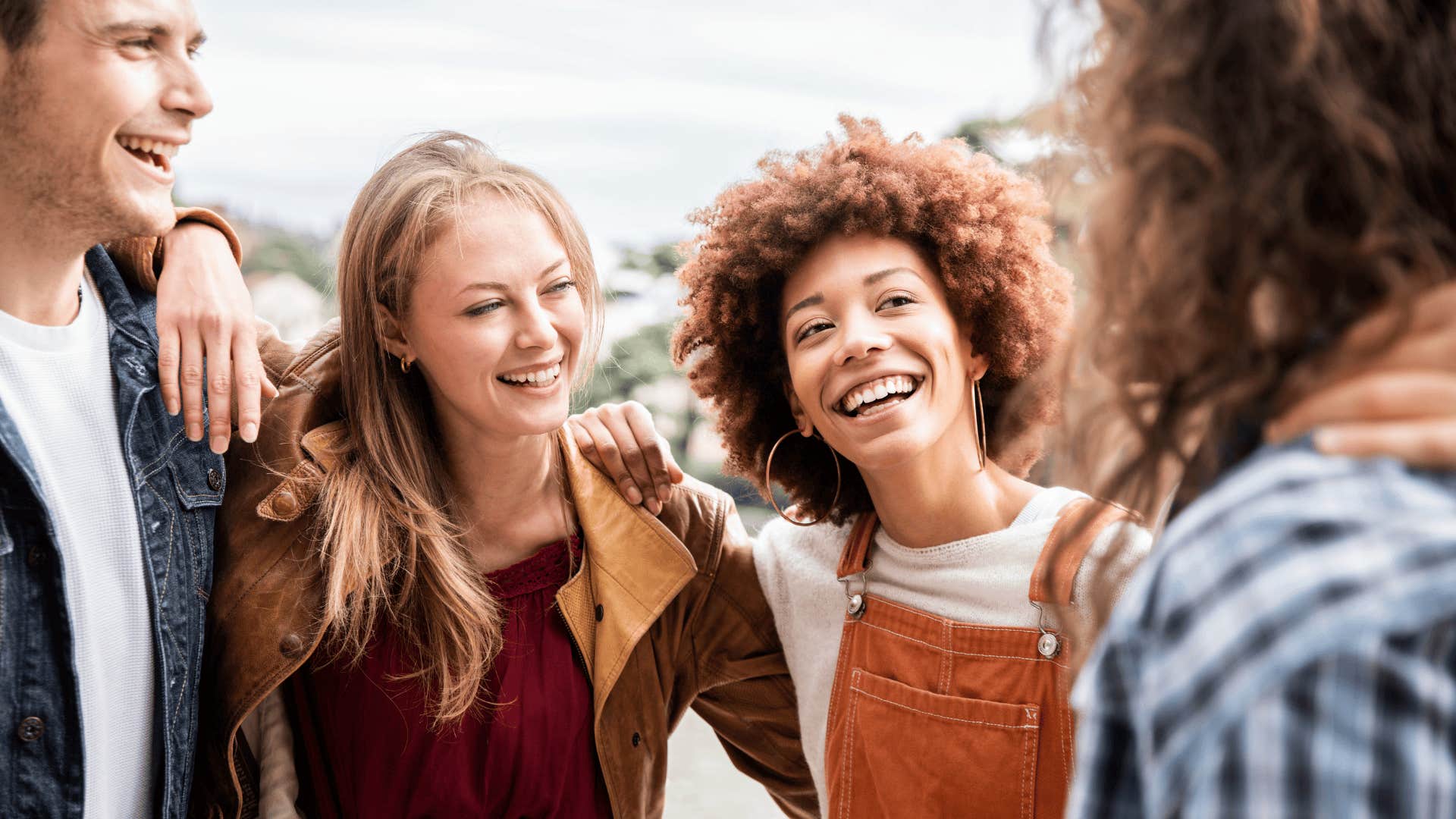 woman with friends and partner who is truly loyal and locked in