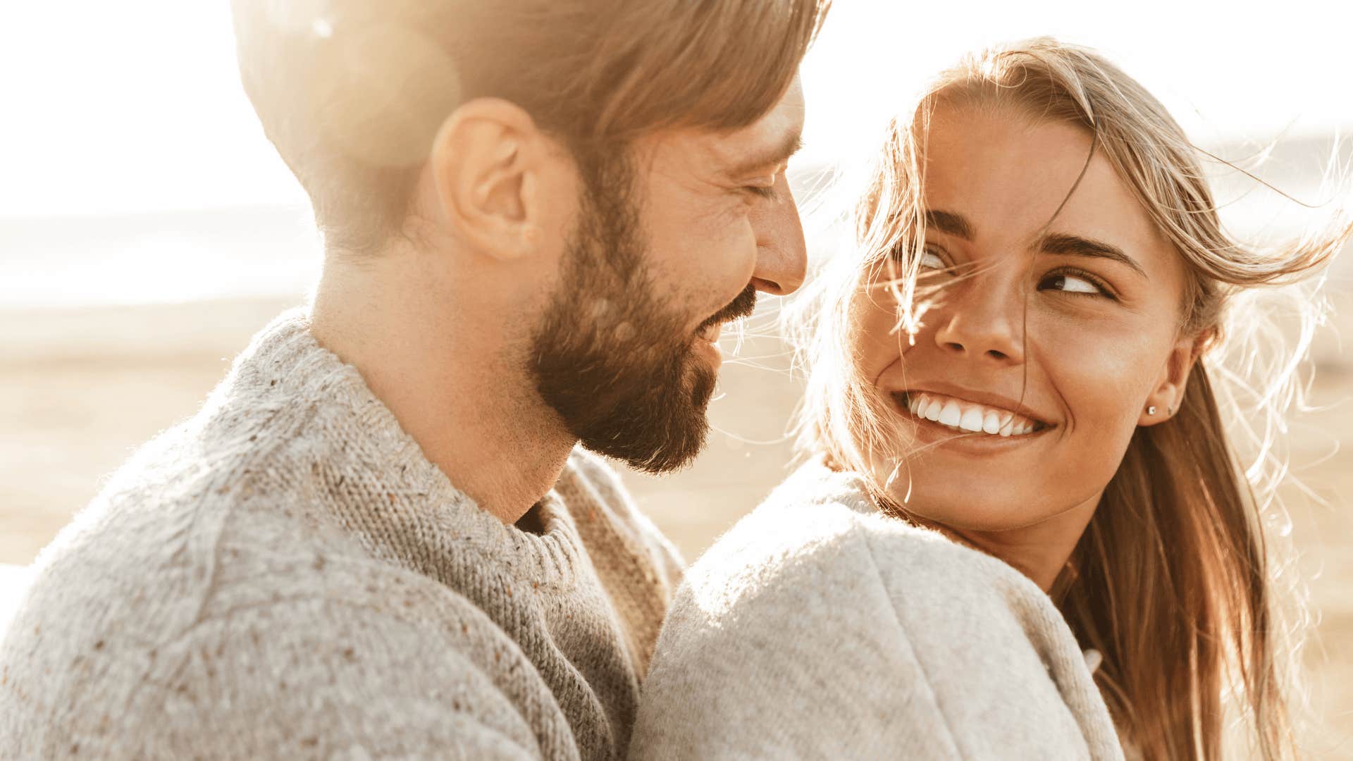 smiling woman with partner who is loyal and locked in