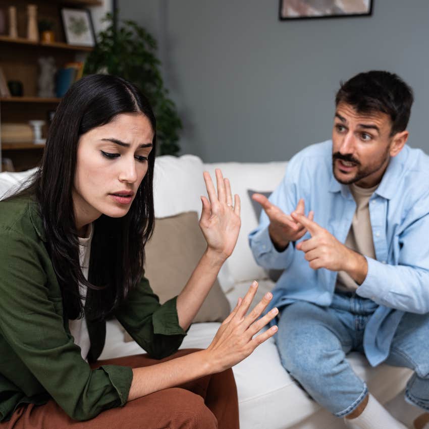 woman being quietly abused arguing with man