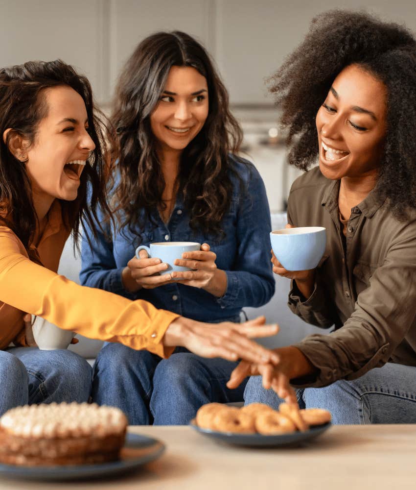 Three sisters laugh while sharing advice