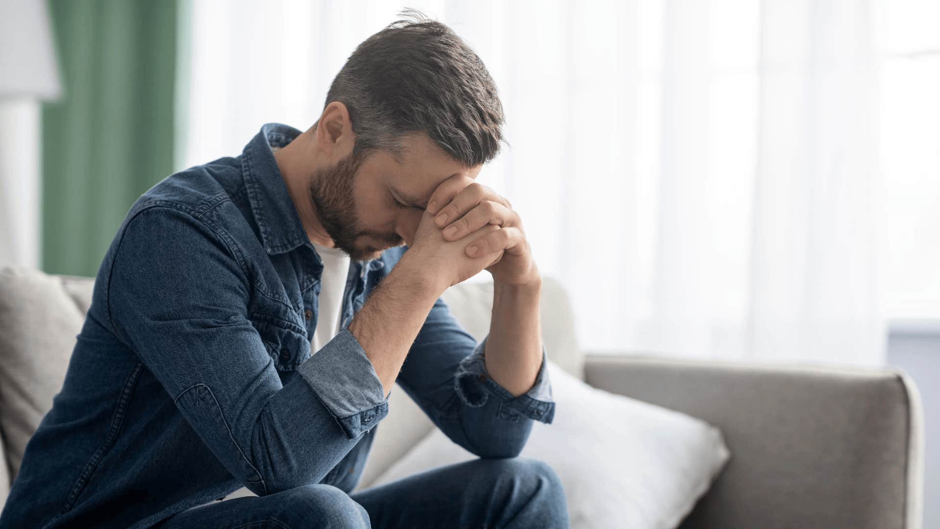 man upset haunted by regrets that destroyed his marriage