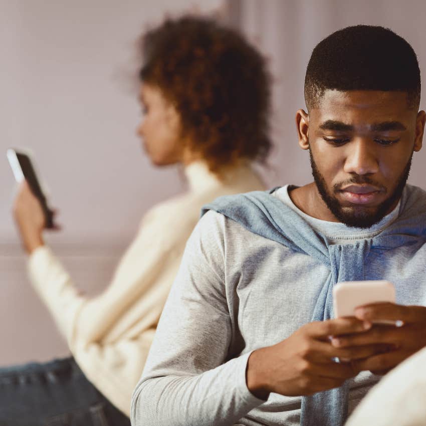 couple ignoring each on phone because of dead marriage