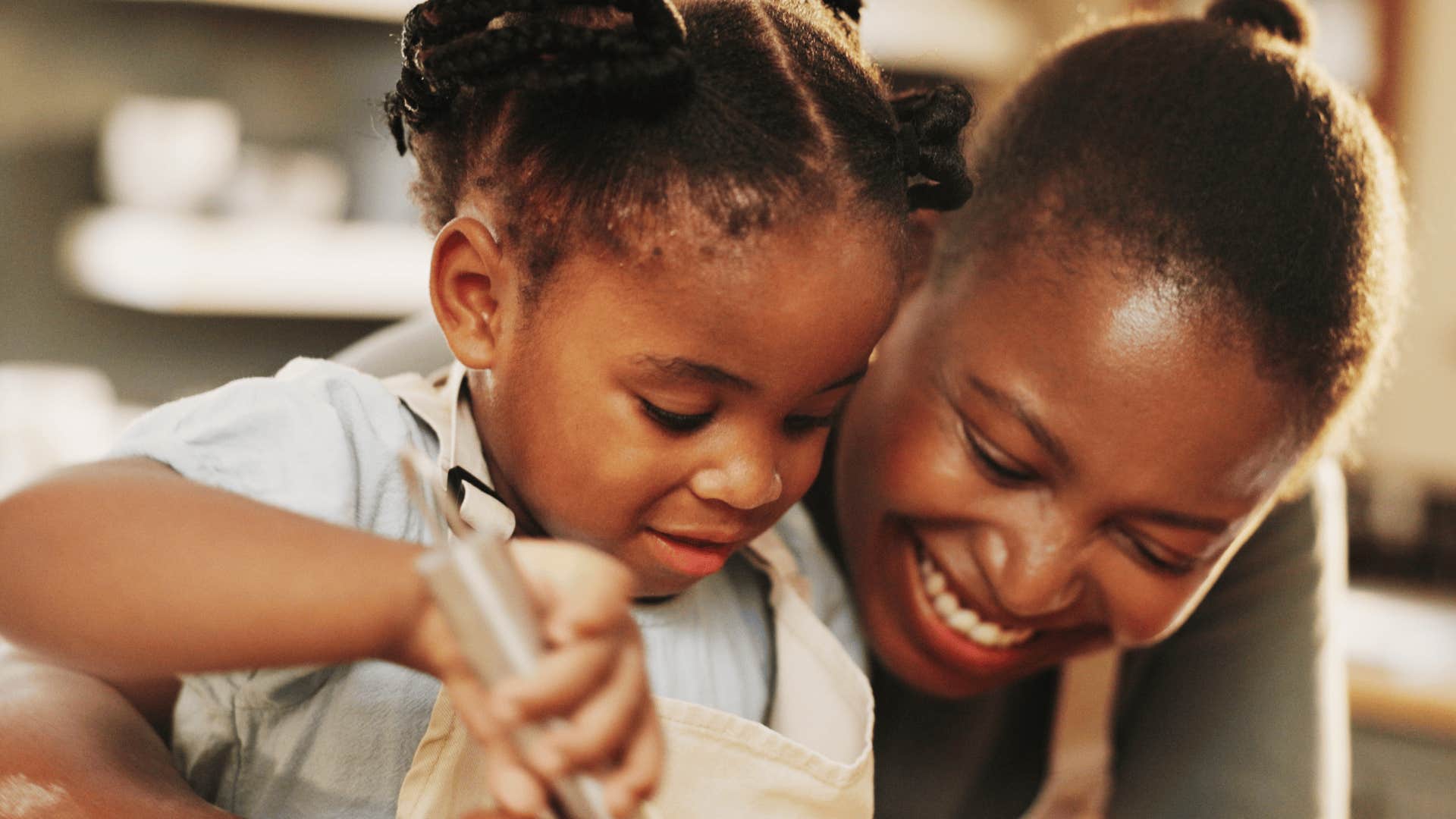 mother and daughter cooking together