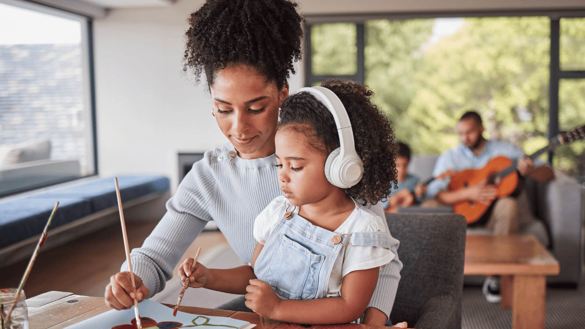 mother and daughter painting together