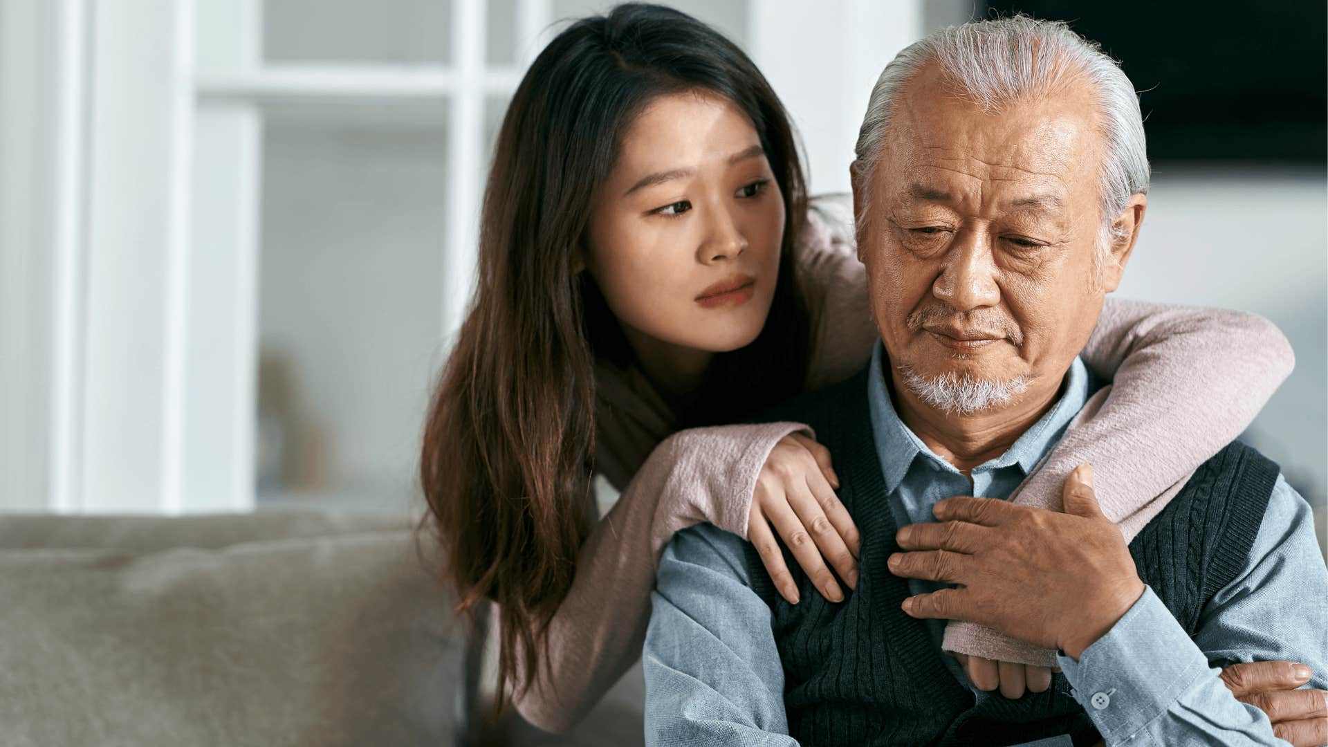 upset woman comforting her father