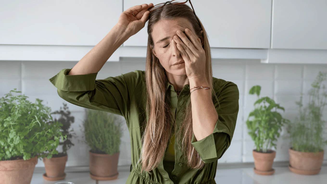 Signs A Grown Daughter Feels Quietly Responsible For The Happiness Of Her Parents frustrated young woman rubbing her eyes