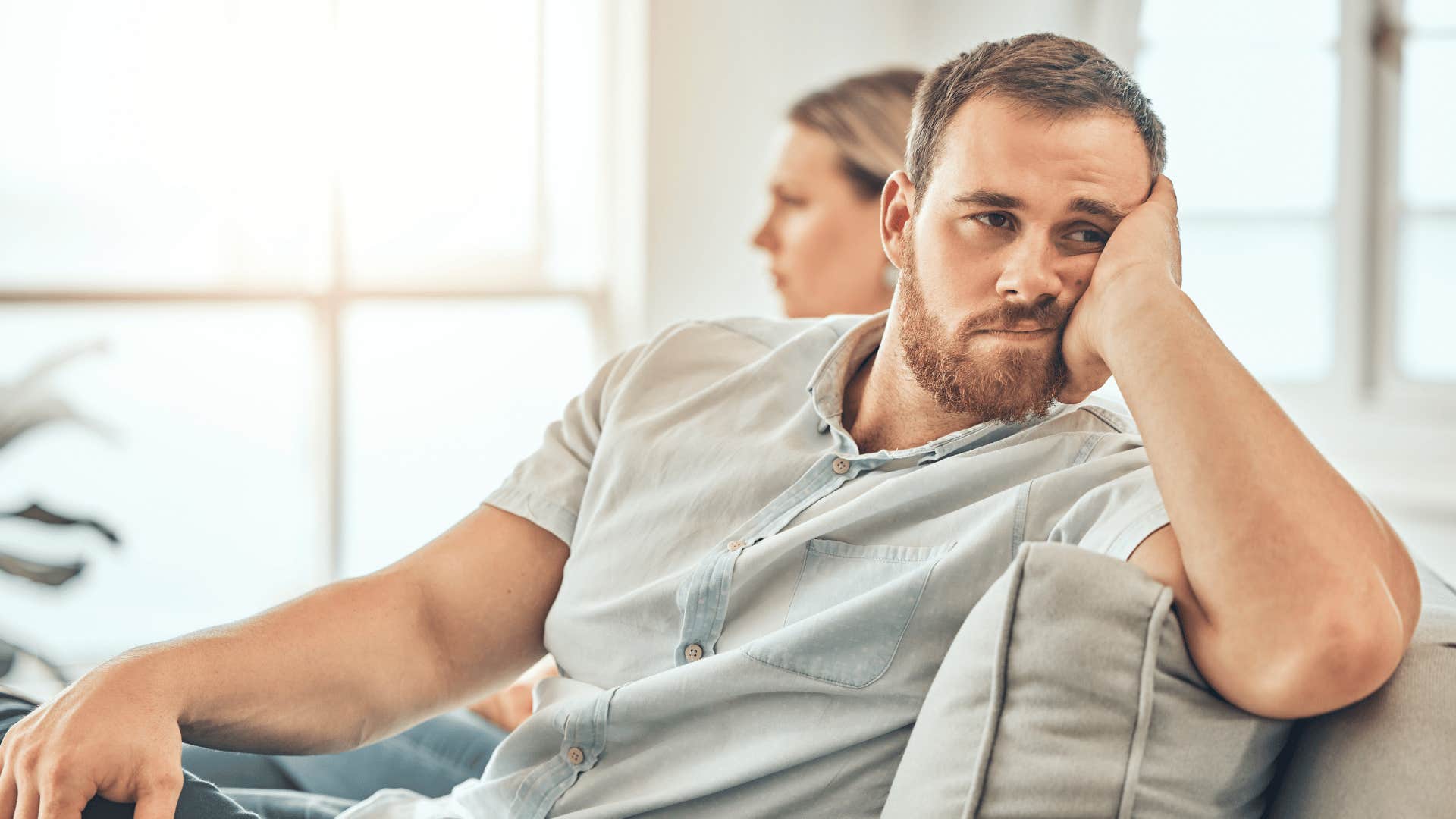 man daydreaming about another life