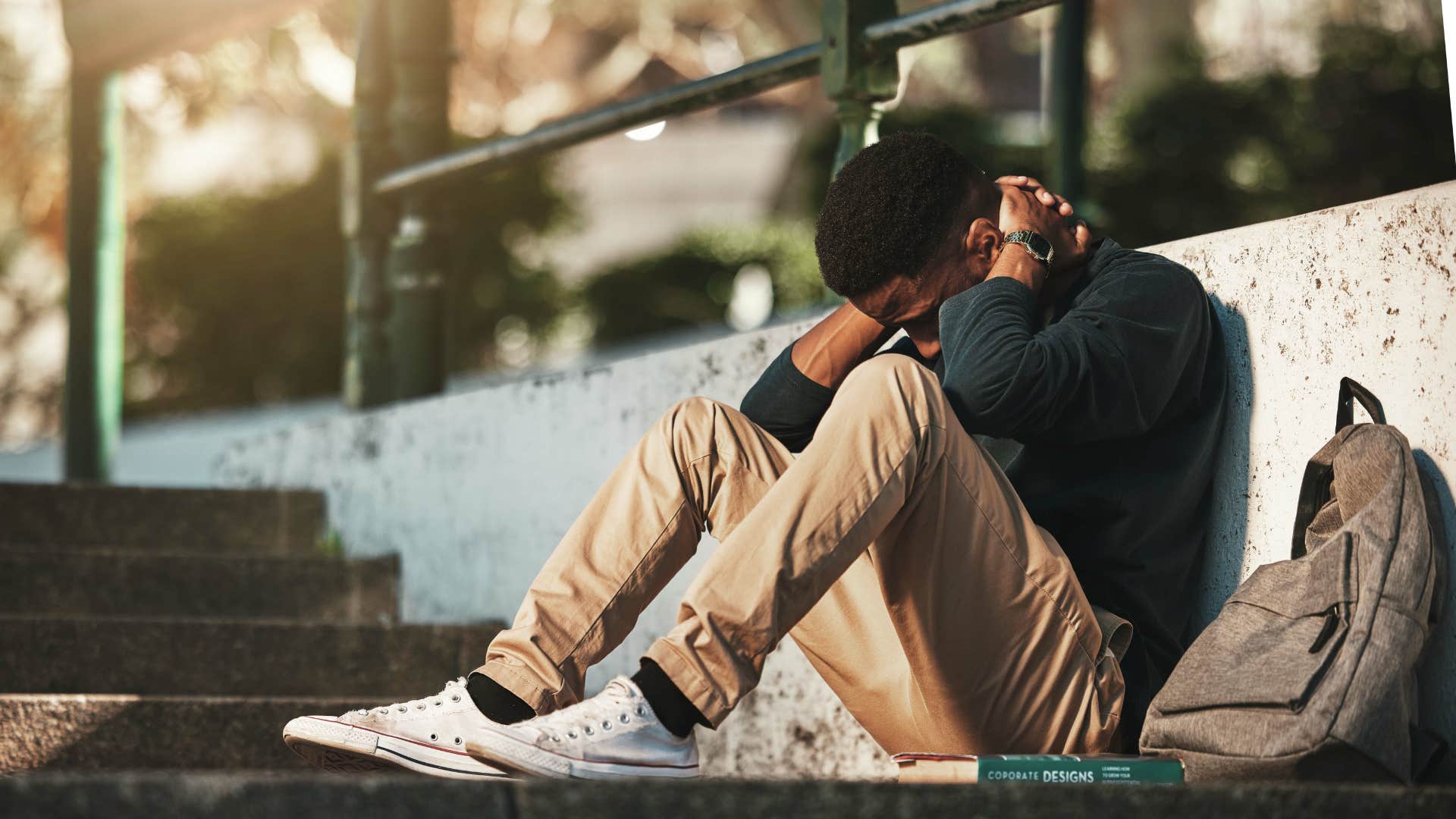 man is angrier than usual because he is emotionally exhausted but pretending to be ok