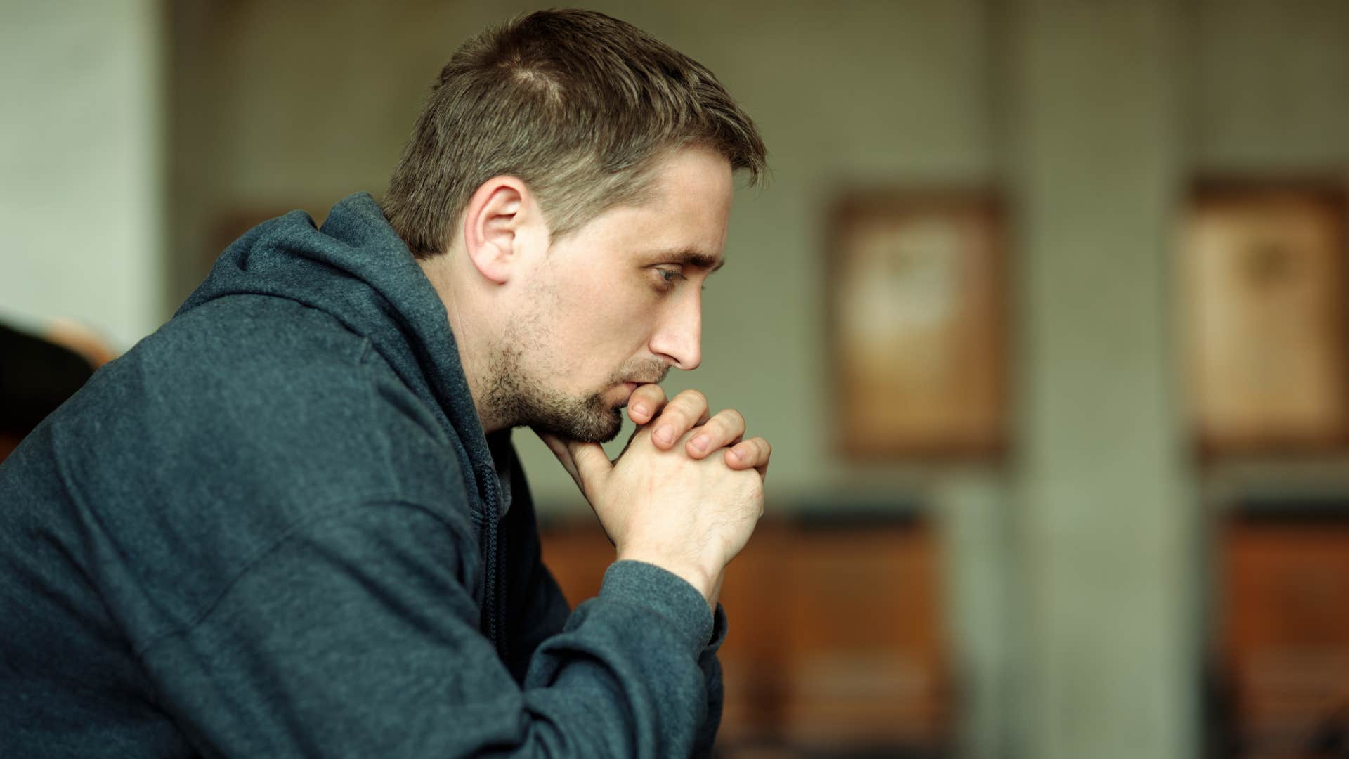 man avoids deep conversations and is emotionally exhausted but pretending to be ok