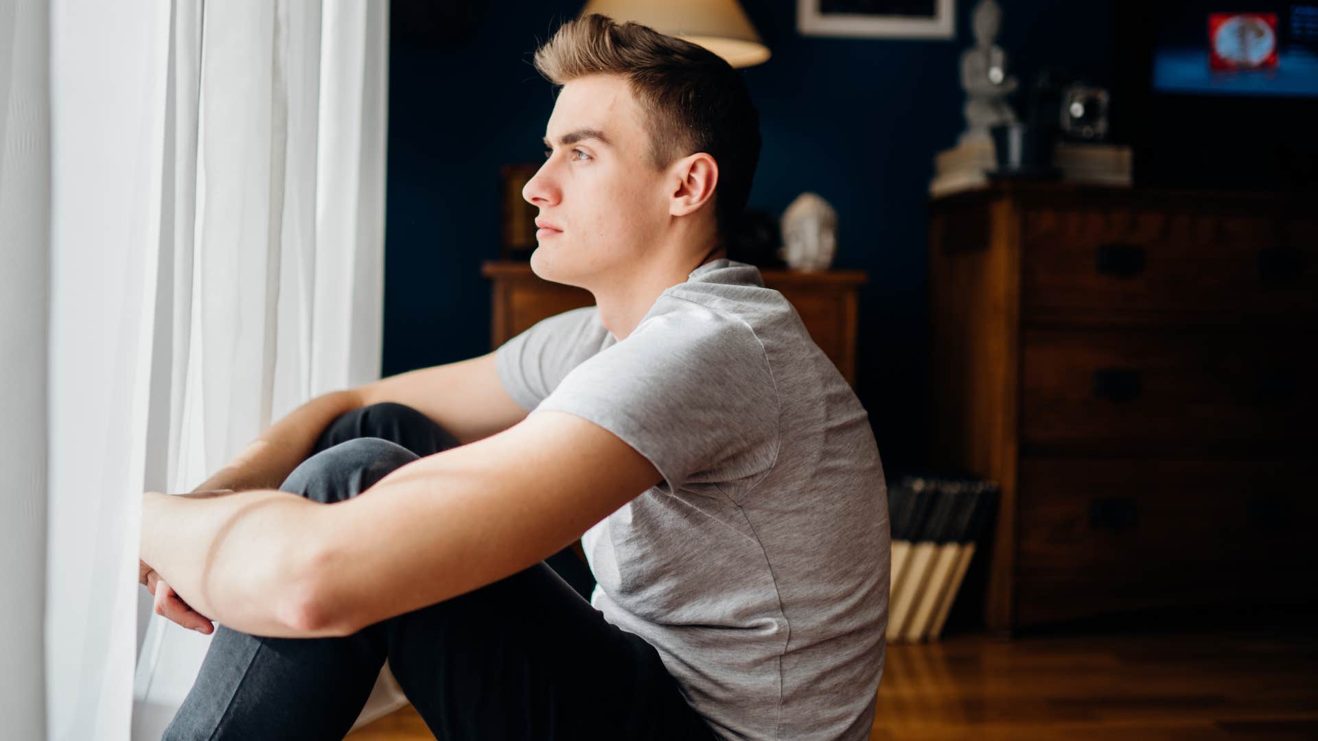 man with a cynical attitude is emotionally exhausted but pretending to be ok