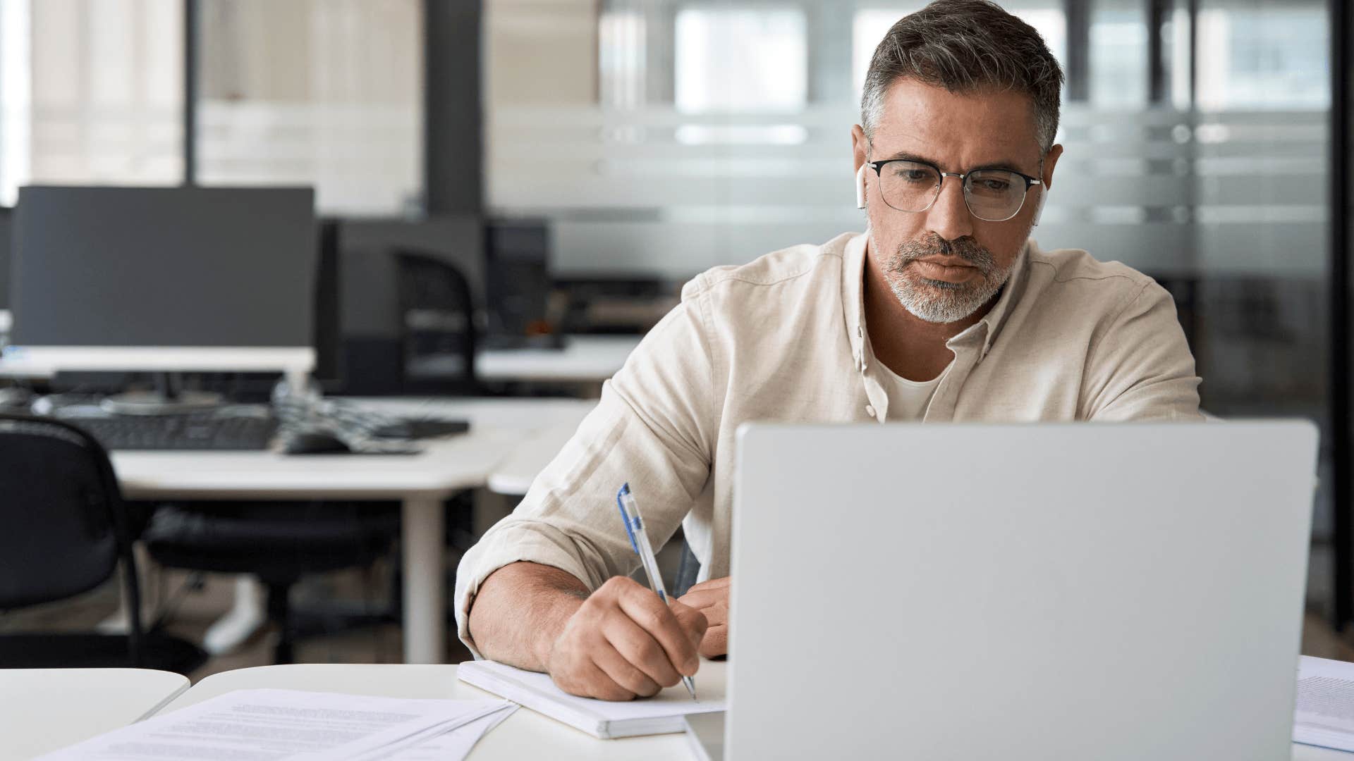upset man distracting himself with work