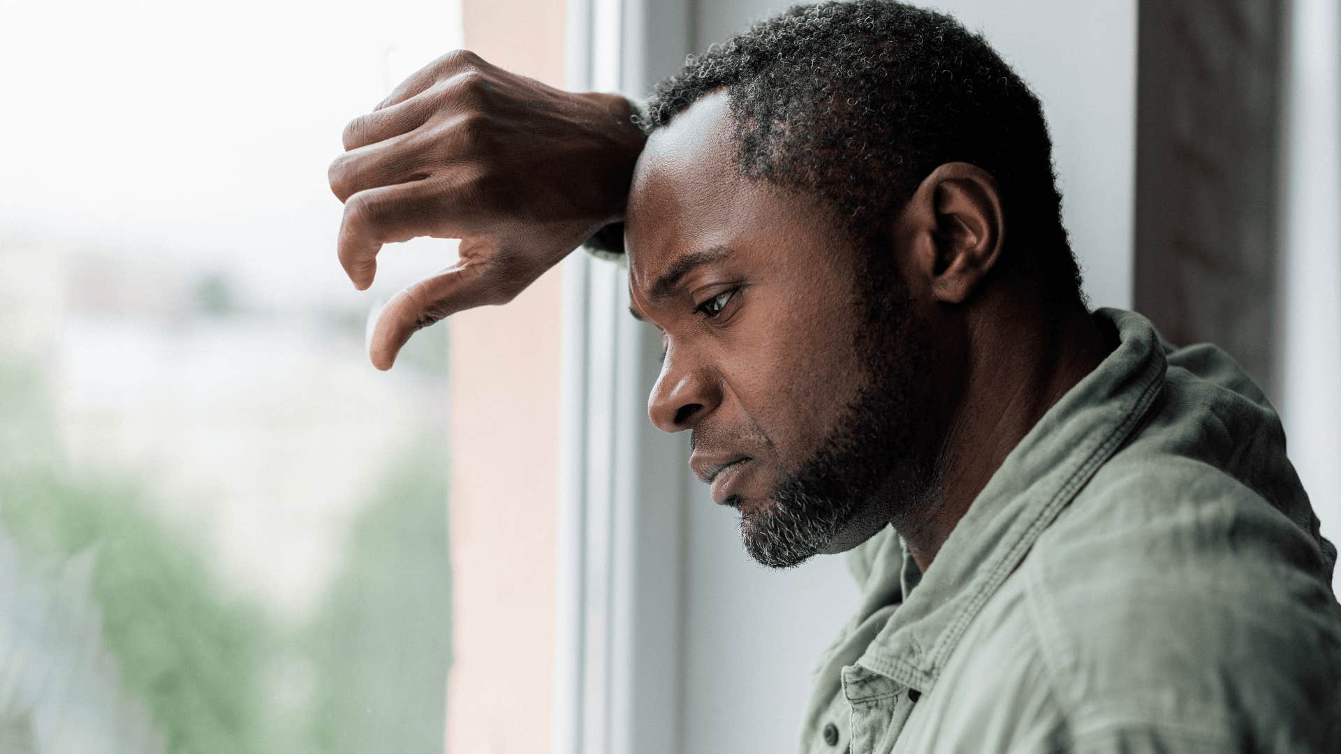 upset man thinking through his trauma