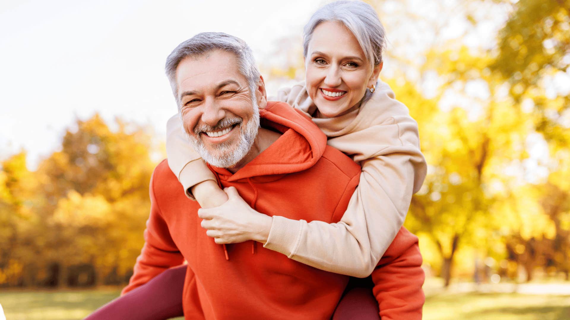 older couple smiling outside