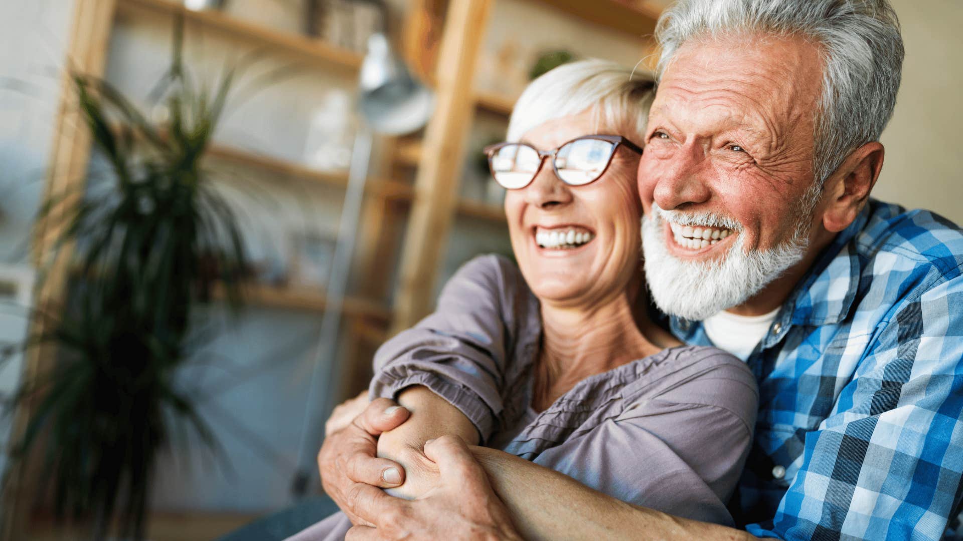 older couple smiling and hugging
