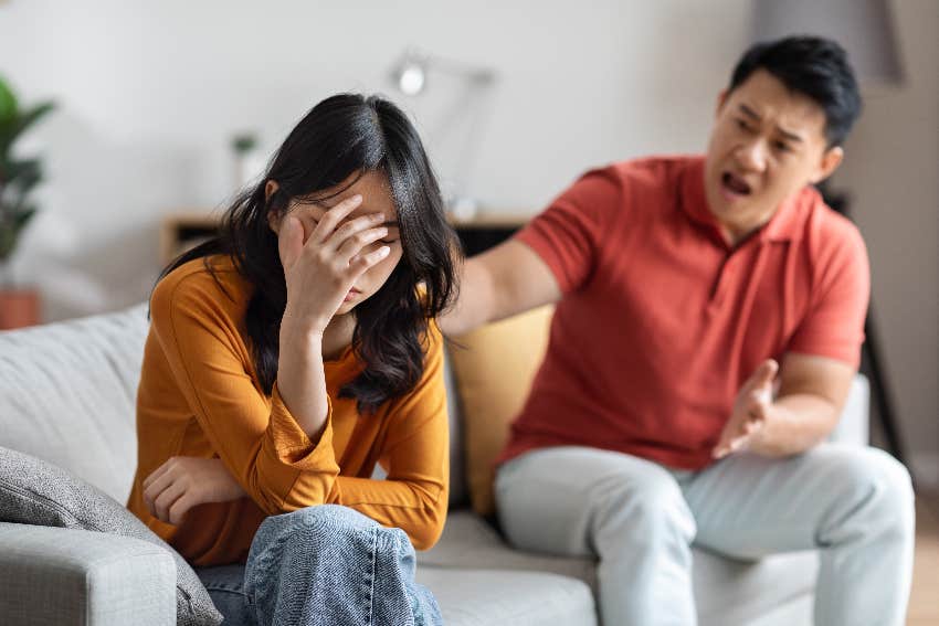 couple arguing on couch