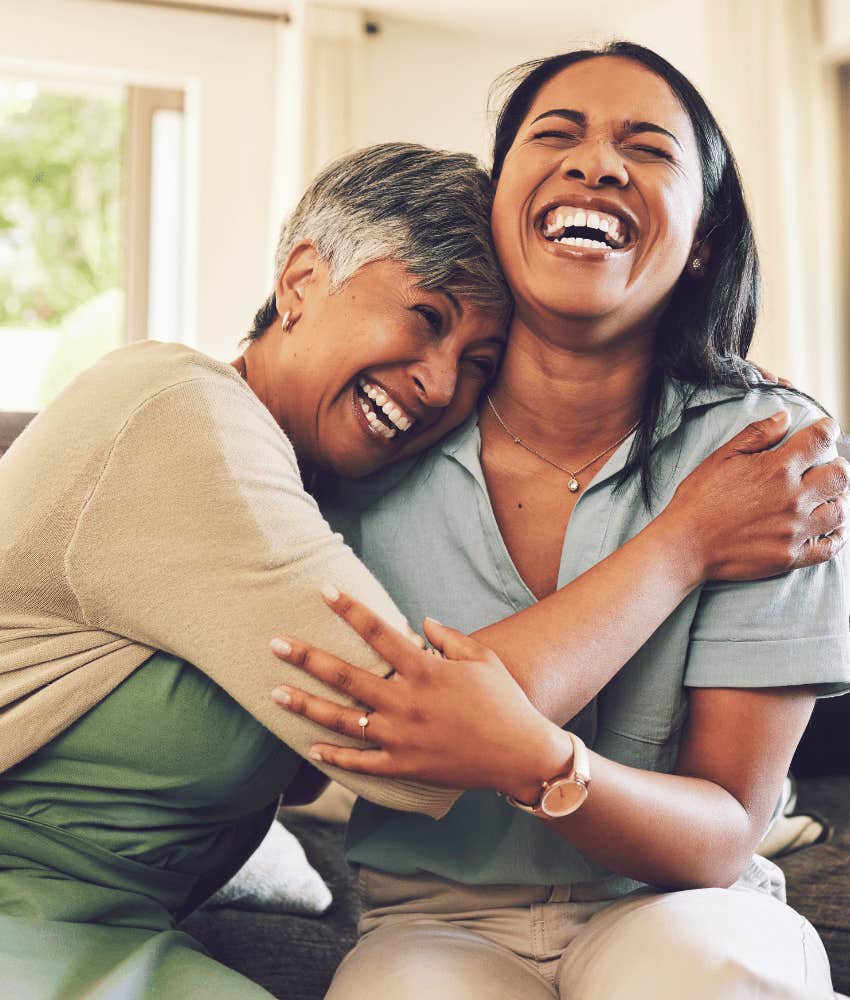 Playful women aren't closed to magic as they hug an laugh 