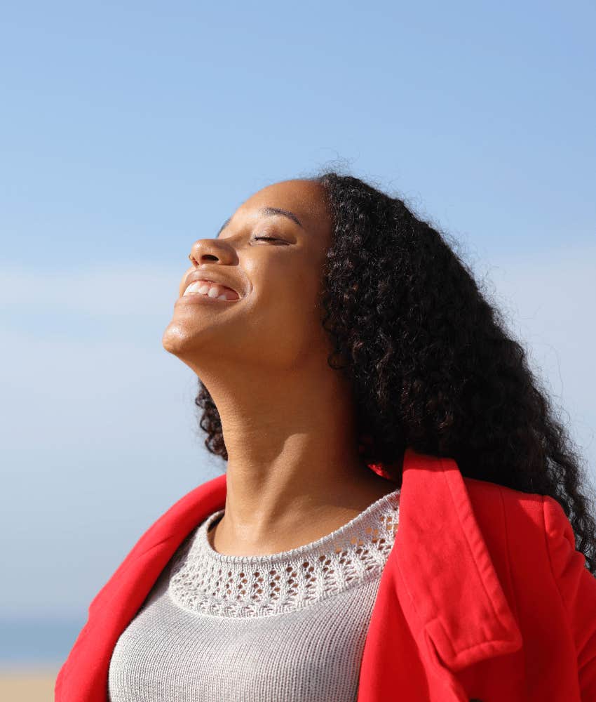 Joyful woman smiles and trusts herself