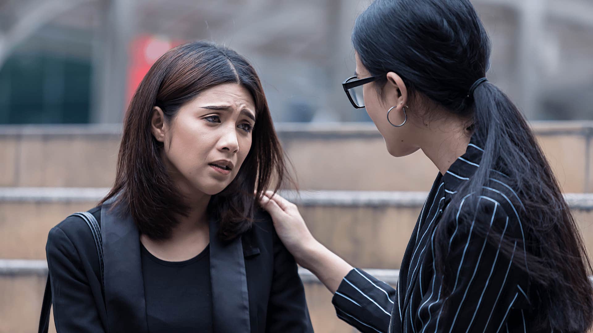 friend consoling upset woman