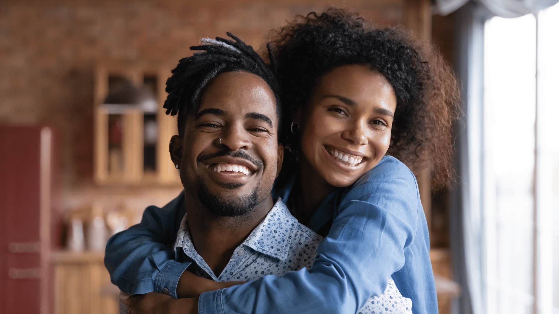 Top-tier husband hugs wife because kindness goes a long way