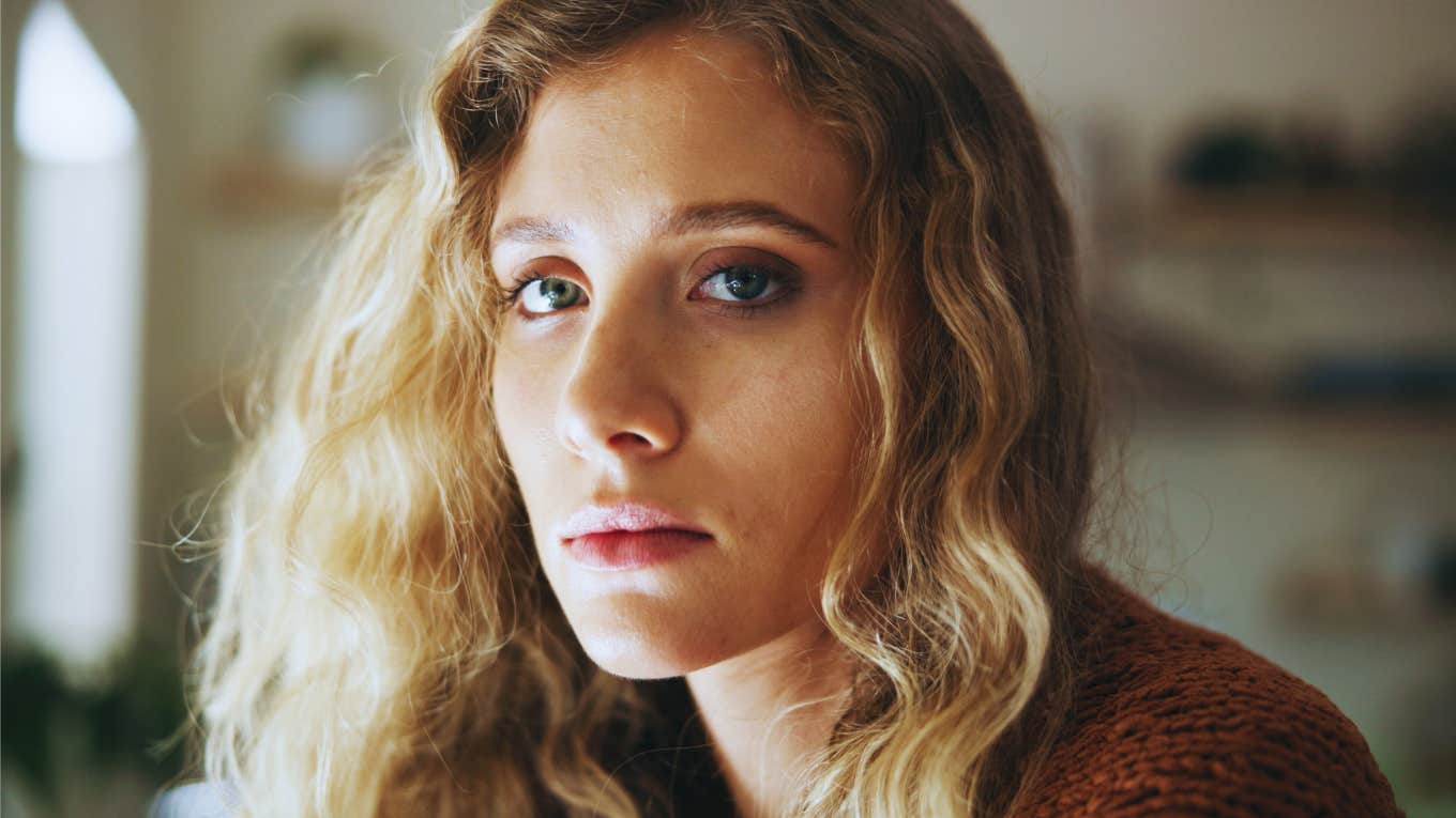 Signs A Woman Is Emotionally Drained But Keeps Pushing Through emotionally drained woman looking stressed