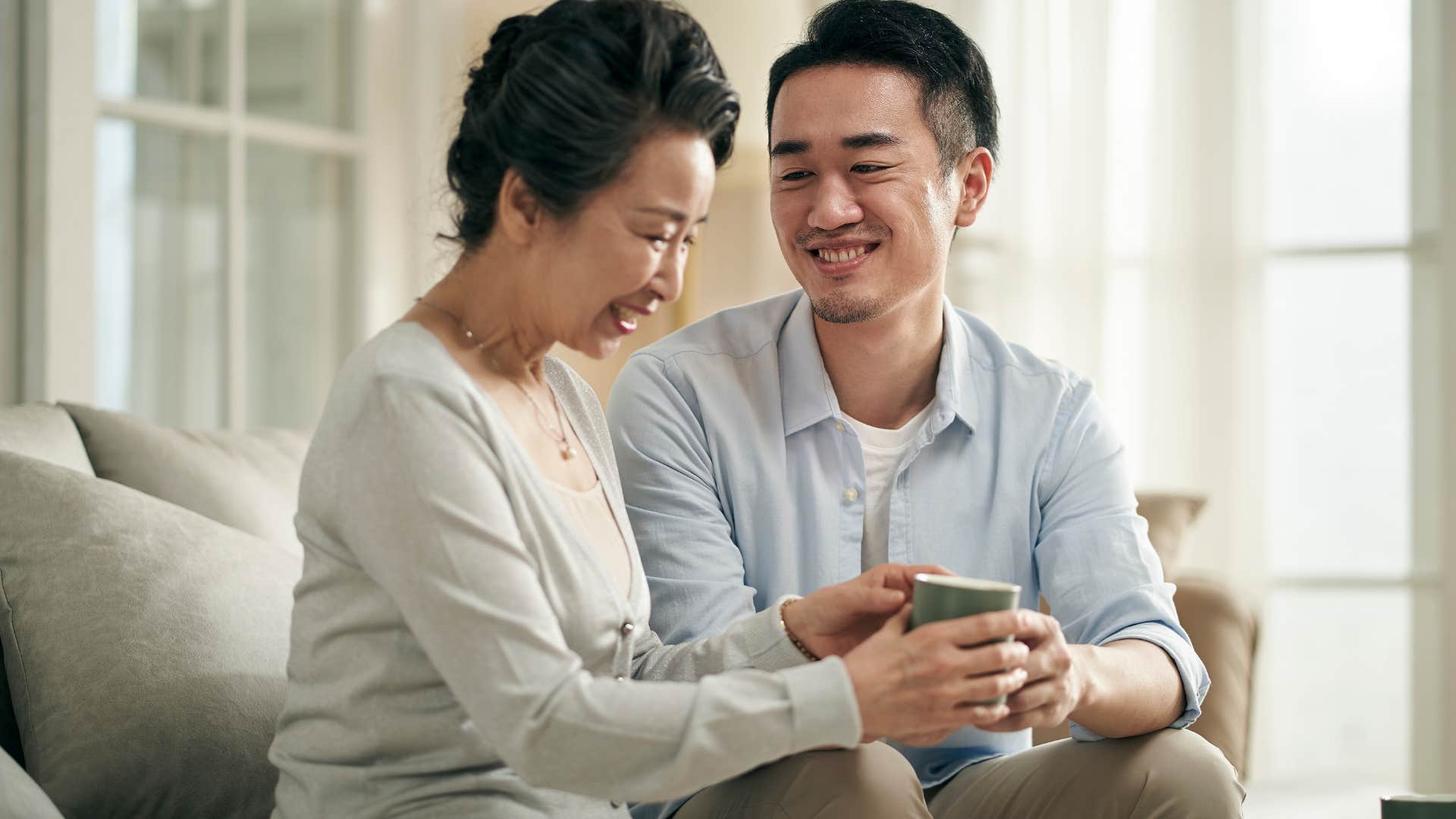 Adult son getting thoughtful advice from his Gen X mom