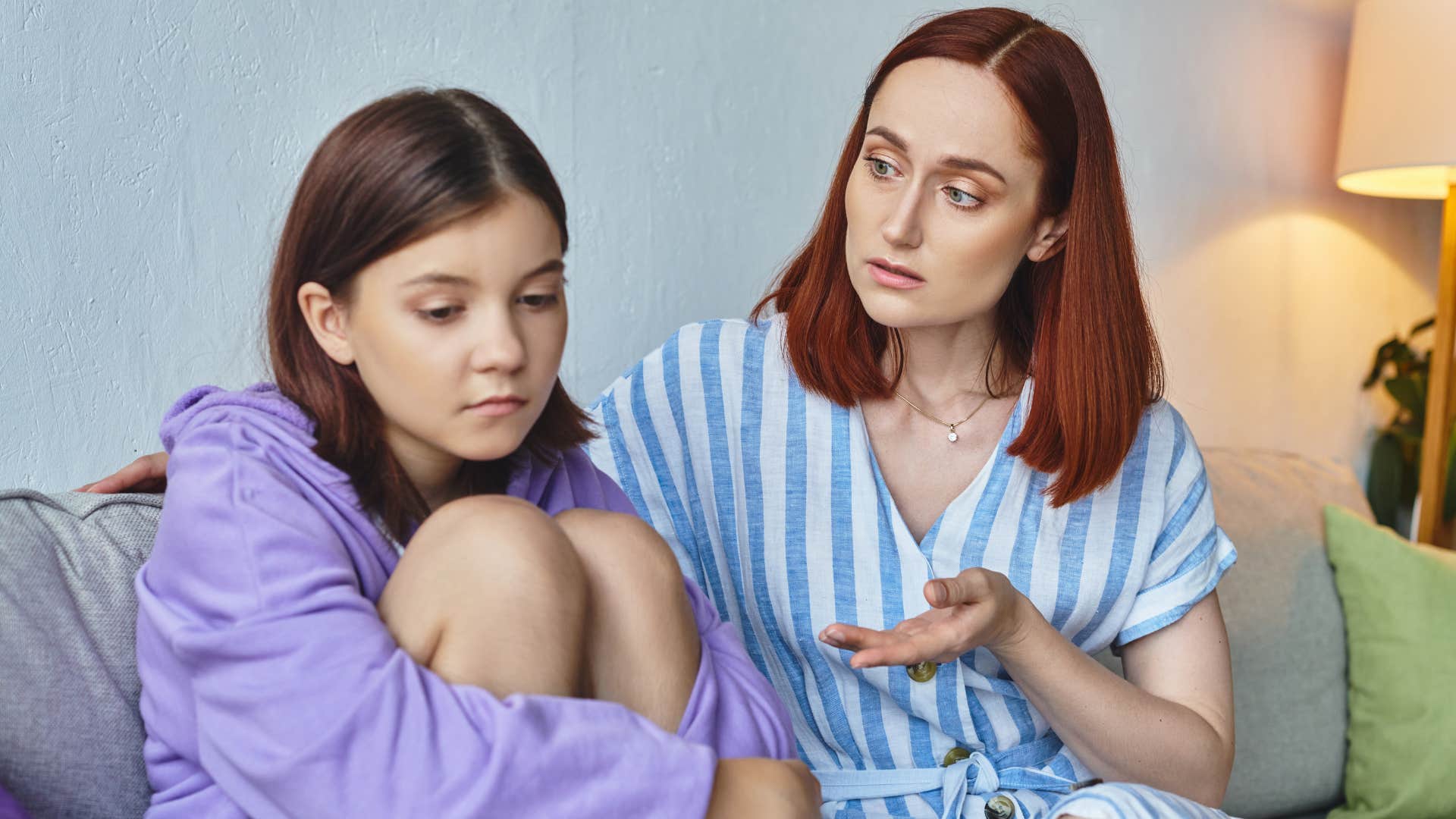 upset woman arguing with her teenage daughter