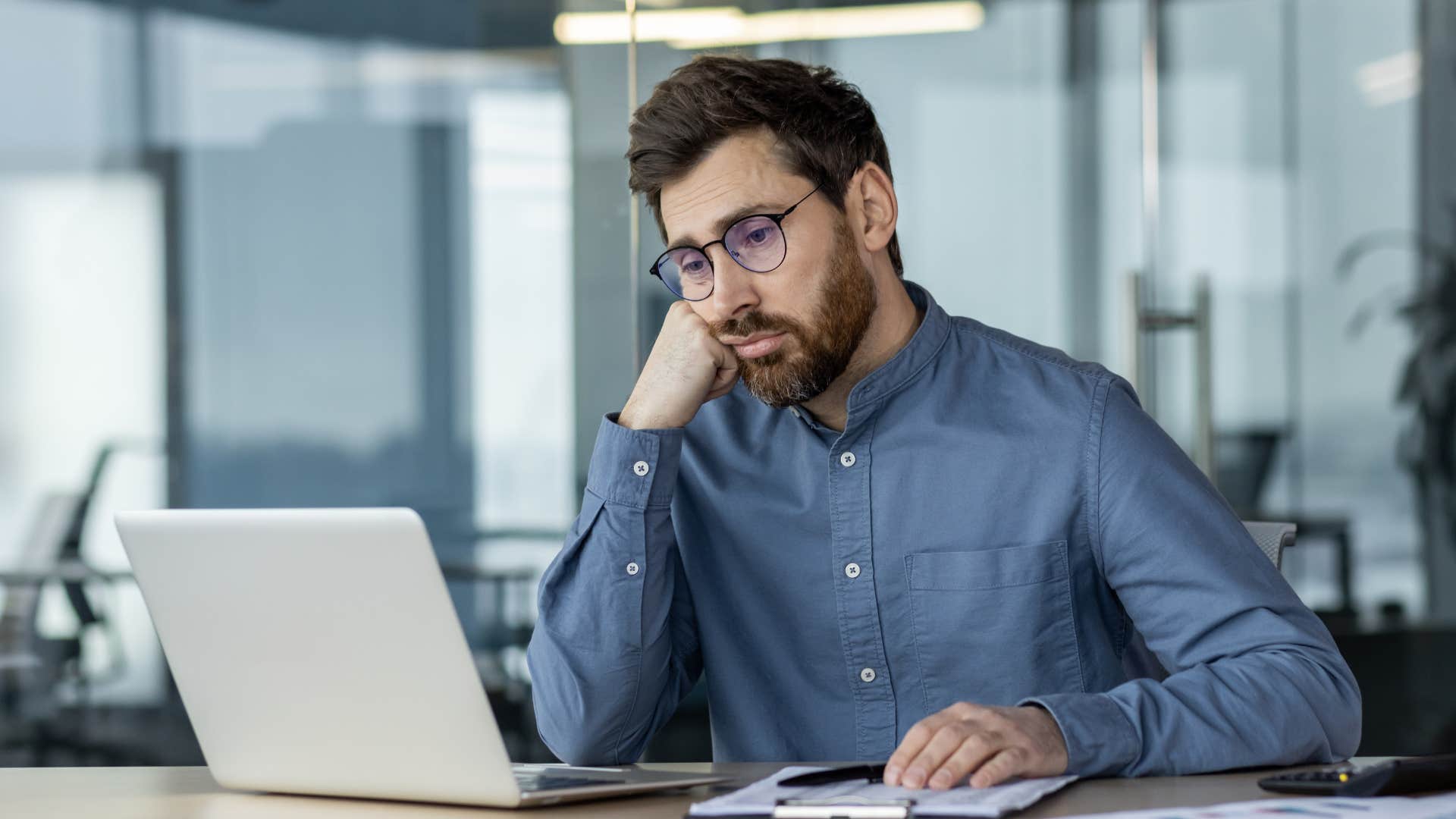 bored man having trouble focusing at work