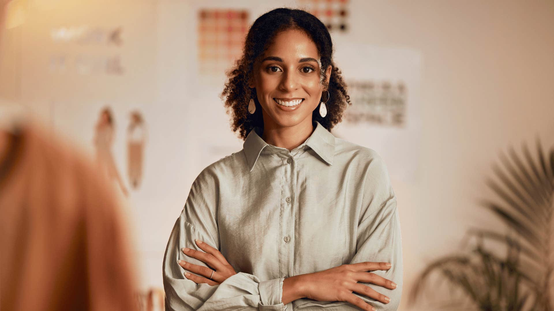 smiling woman with her arms crossed