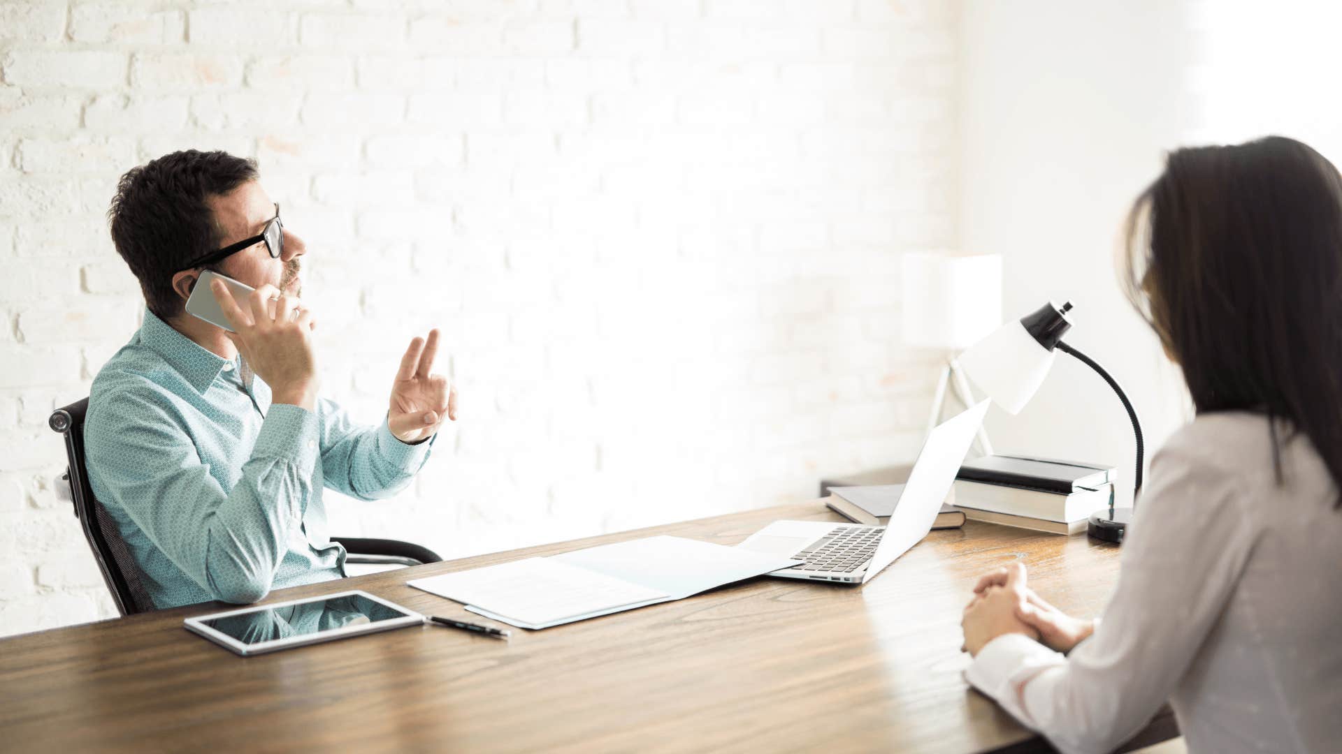 man interrupting woman that makes him look way less experienced