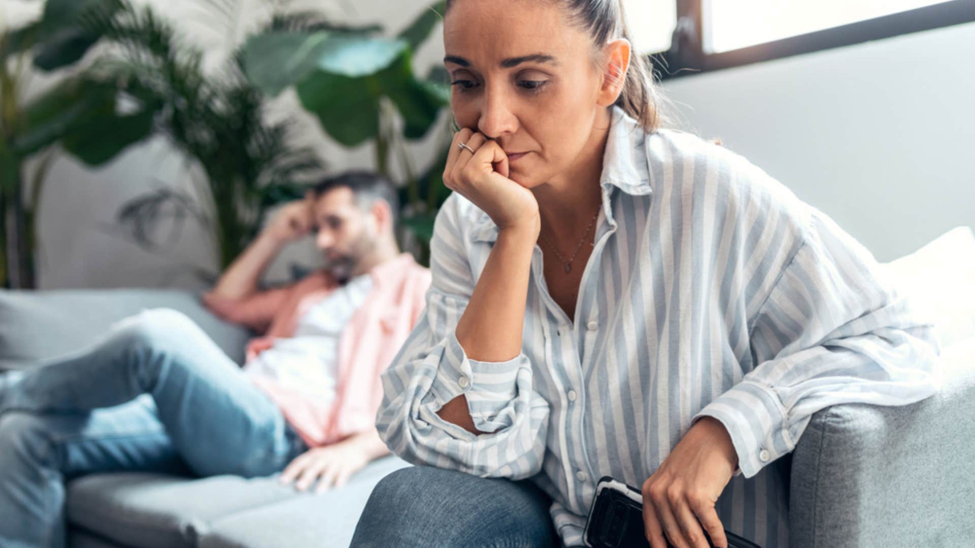 unhappy woman turned away from partner