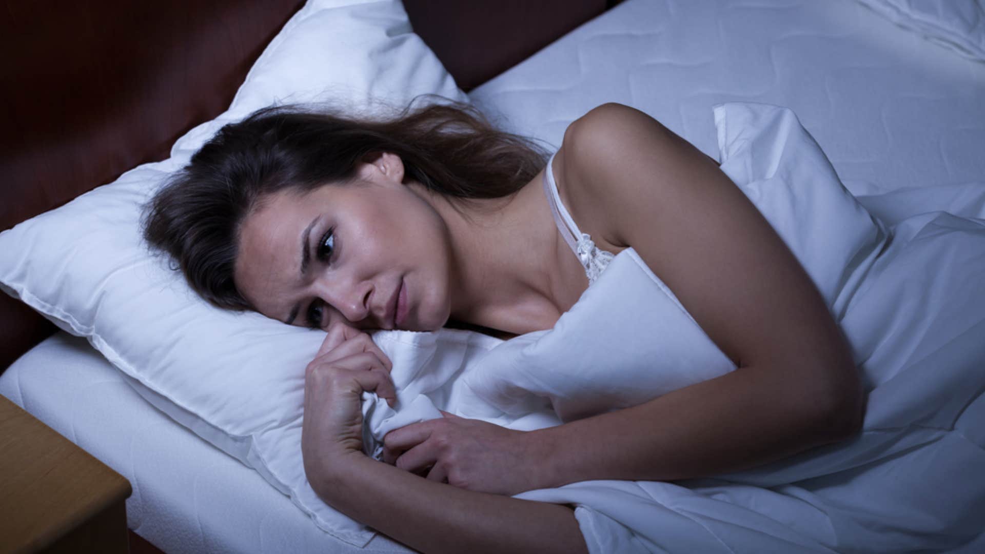 very tired woman unable to sleep