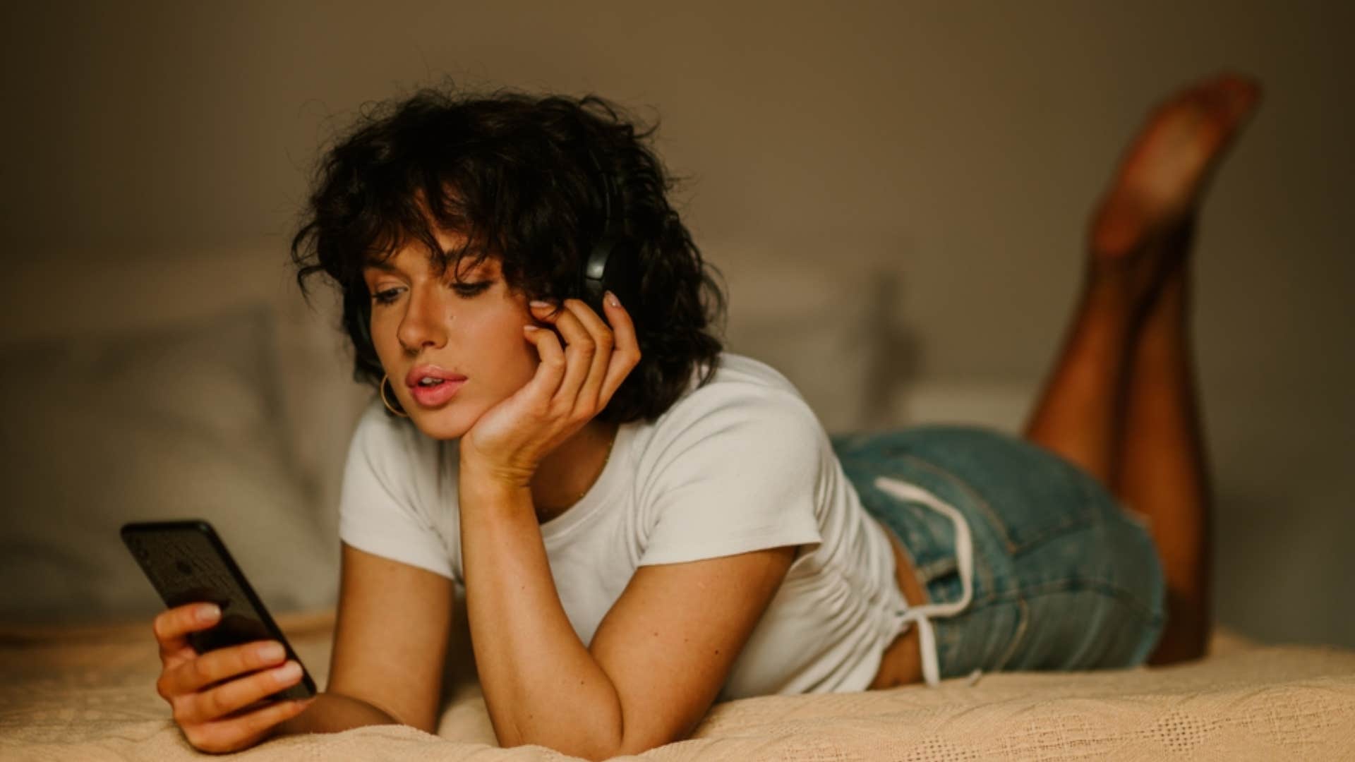 unhappy woman mindlessly scrolling social media